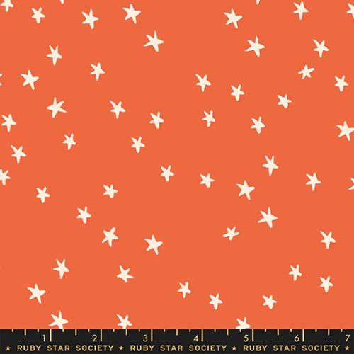Starry Nutmeg cotton fabric by Ruby Star Society featuring scattered cream stars on a warm orange background.