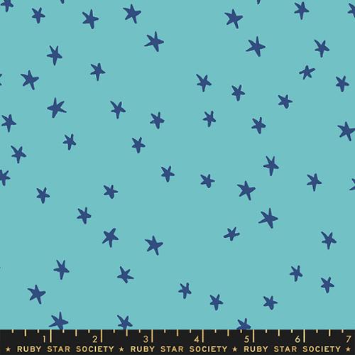 Starry Turquoise cotton fabric by Ruby Star Society featuring scattered dark blue stars on a bright turquoise background.