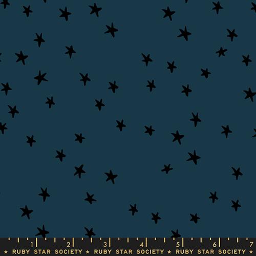 Starry Smoke cotton fabric by Ruby Star Society featuring scattered black stars on a deep smoky blue-gray background.