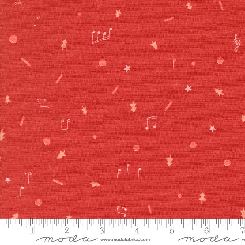 Red holiday fabric with tiny scattered Christmas motifs including music notes, stars, trees, and ornaments by Lizzie House for Moda Fabrics