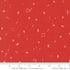 Red holiday fabric with tiny scattered Christmas motifs including music notes, stars, trees, and ornaments by Lizzie House for Moda Fabrics