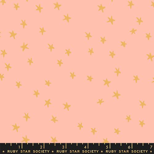 Starry New Peach fabric by Alexia Abegg for Ruby Star Society featuring scattered golden star motifs on a soft peach background.