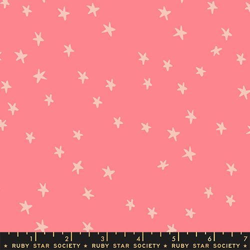 Starry New Watermelon fabric by Alexia Abegg for Ruby Star Society featuring scattered cream stars on a warm watermelon pink background.