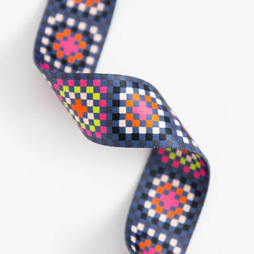 colorful granny square webbing strap dark background