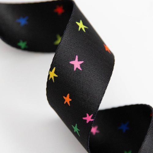 black webbing with colorful stars for bag straps and sewing projects