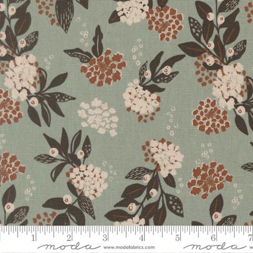 Wellspring Mochi Linen Storm fabric by Moda with ivory and rust florals, dark leaves, and a muted blue-gray background.