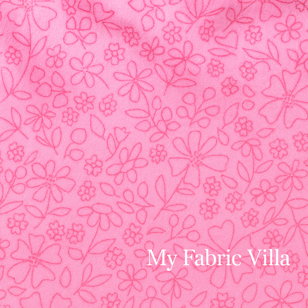 Close-up view of Sherbet Sunshine Flannel – Sketch Florals Petunia Fabric by Corey Yoder for Moda Fabrics, showing hand-drawn pink floral outlines on soft petunia pink flannel background.