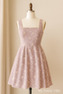 A mannequin dressed in a mauve cotton embroidered dress made from floral-patterned fabric. The dress features delicate white threadwork, short sleeves, and an A-line silhouette, displayed in a softly lit boutique setting with a “My Fabric Villa” watermark on the right side.