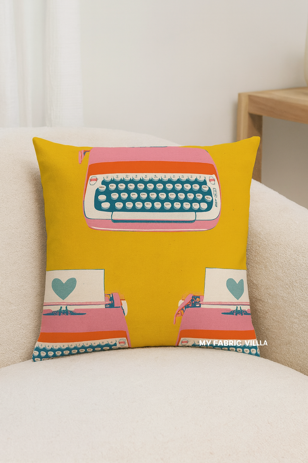 A decorative pillow and tote bag made from Ruby Star Society’s Best Day Ever Typewriters Golden Canvas fabric by Melody Miller for Moda Fabrics, featuring retro typewriters in pink, teal, and orange on a mustard yellow background.