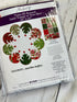 Winterberry Quilt Kit by Martha Negley for Free Spirit Fabrics featuring festive holiday quilt fabrics in red and winter floral prints