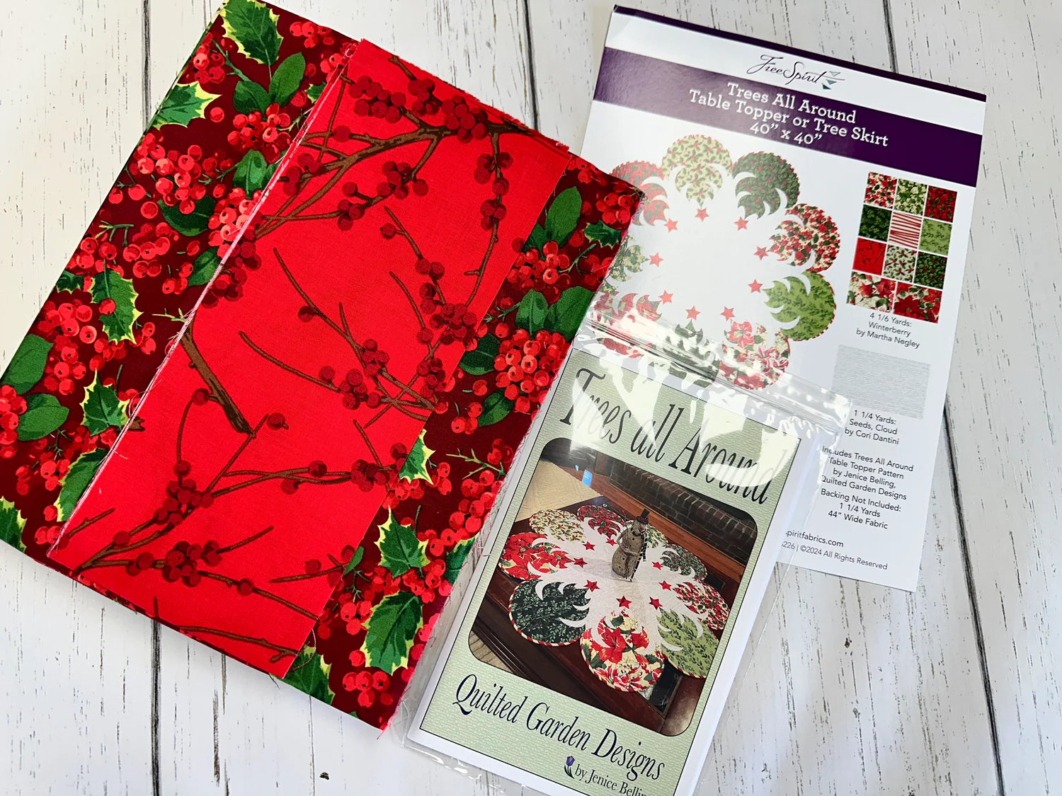 Winterberry Quilt Kit by Martha Negley for Free Spirit Fabrics featuring festive holiday quilt fabrics in red and winter floral prints