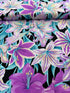Kaffe Fassett Amaryllis Lavender polyester quilting cotton – lavender and teal amaryllis flowers on a black background, 44″ wide
