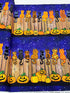 Feline Spooky Cats on Fence cotton fabric by Timeless Treasures featuring colorful Halloween cats, pumpkins, spider webs, and a rustic wooden fence.