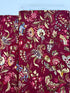 Marseille Red floral cotton fabric by Dover Hill for Benartex featuring ornate botanical flowers and foliage in burgundy, gold, cream, olive green, and blue on a rich red background.