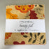 Beauty-Fall Charm Pack by Sandy Gervais for Moda Fabrics featuring 42 coordinated 5-inch cotton fabric squares with autumn florals, leaves, berries, and seasonal prints in warm fall colors.