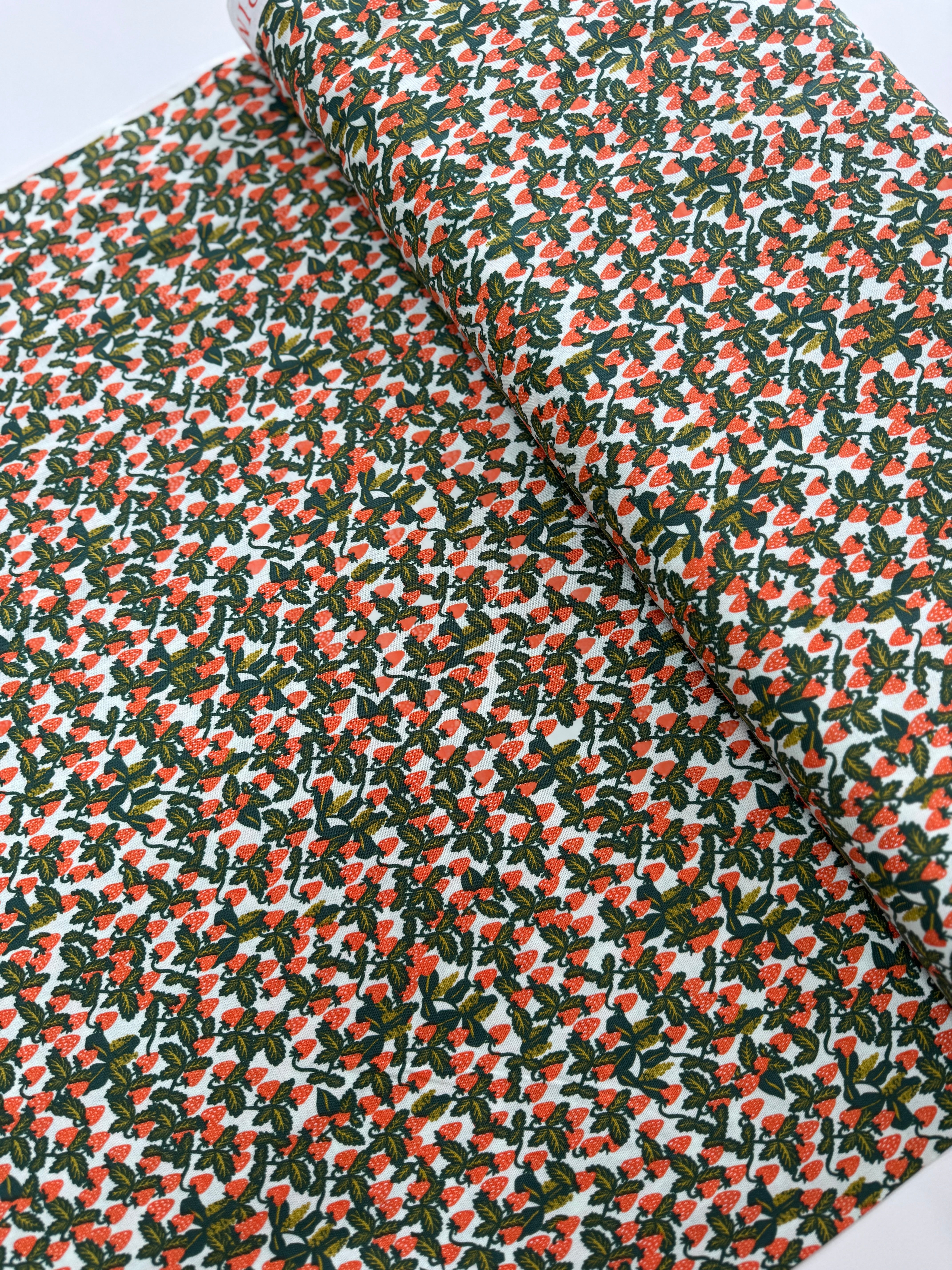 Primavera – Strawberries Mint fabric by Rifle Paper Co. for Cotton + Steel, featuring ripe strawberries and fresh mint leaves on a soft cream background.