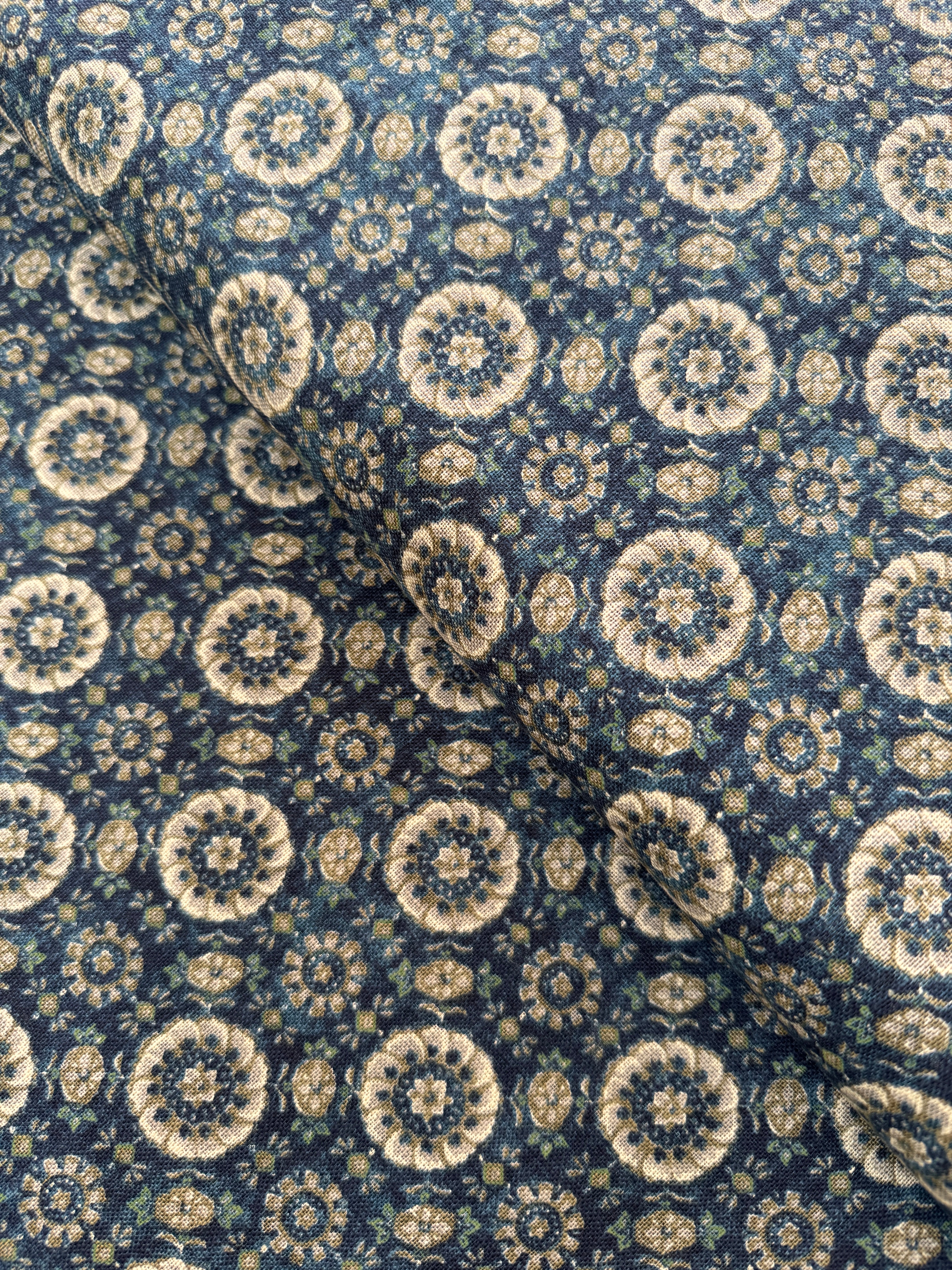 Close-up of Sevenberry Nara Homespun Florals Deep Blue fabric featuring traditional Japanese floral prints on richly textured indigo cotton.