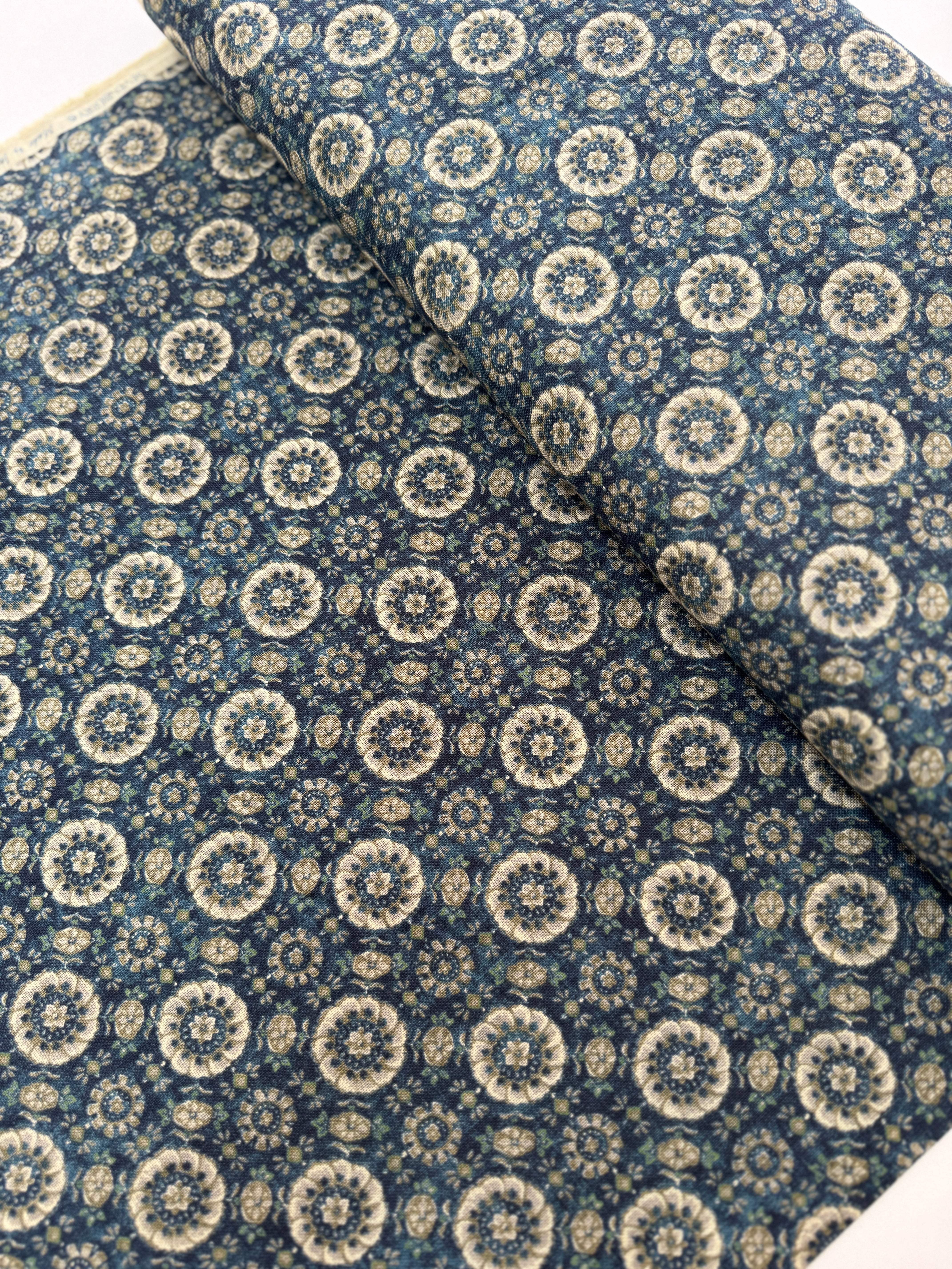 Close-up of Sevenberry Nara Homespun Florals Deep Blue fabric featuring traditional Japanese floral prints on richly textured indigo cotton.