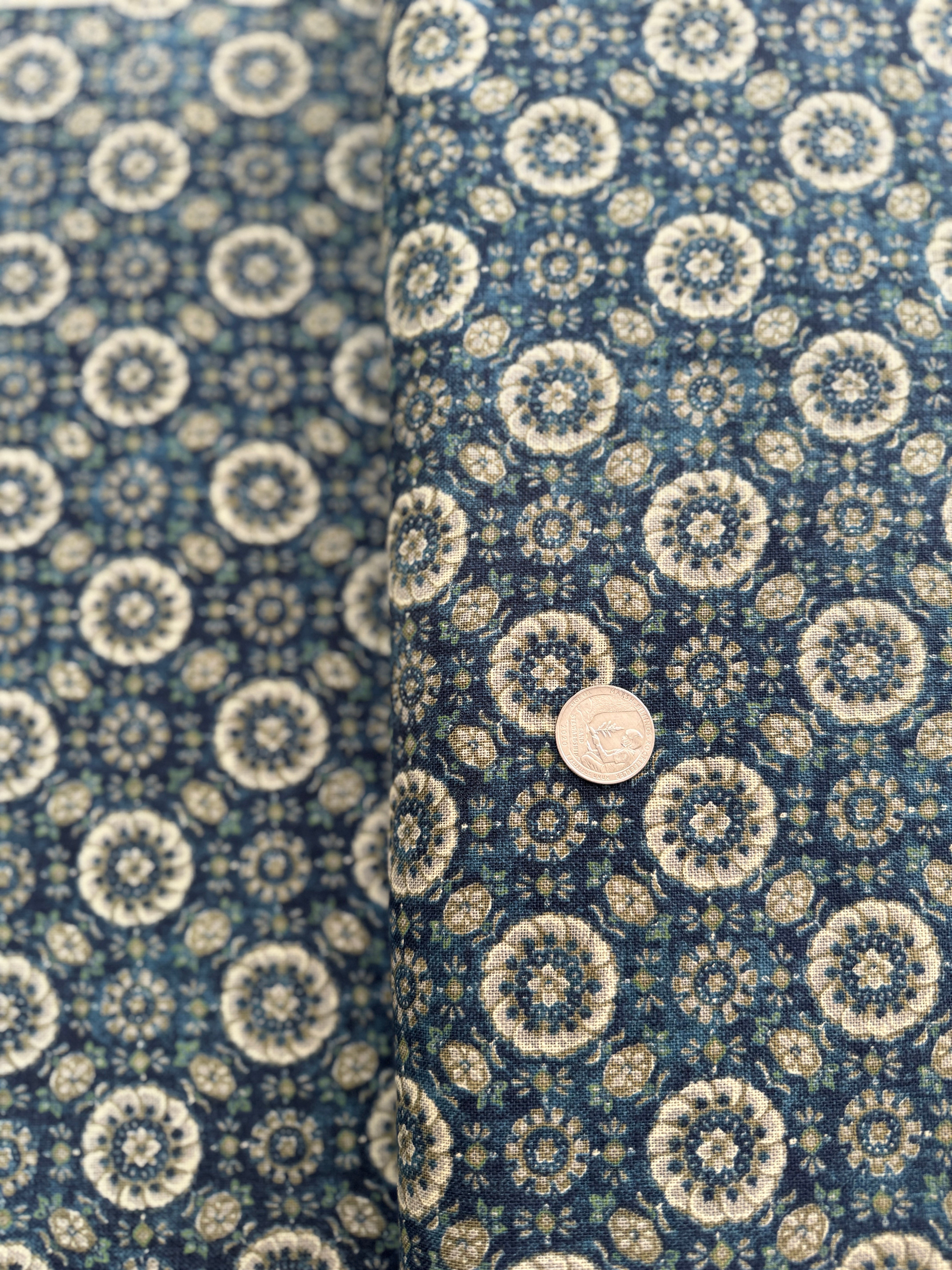 Close-up of Sevenberry Nara Homespun Florals Deep Blue fabric featuring traditional Japanese floral prints on richly textured indigo cotton.