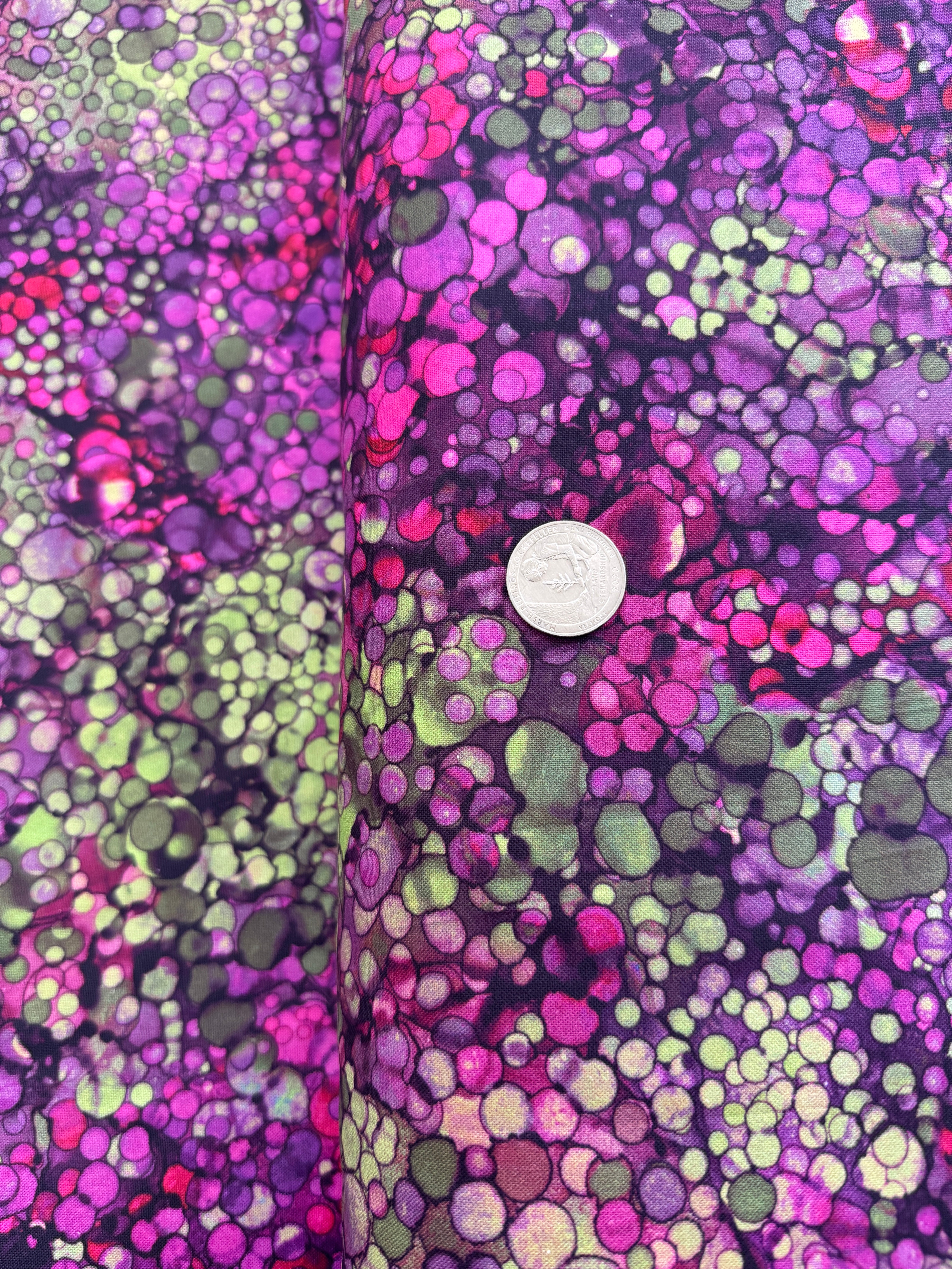 Bliss Wide Backing – Heather 108" wide quilt backing fabric by Northcott, featuring a digitally printed mottled green and purple background with subtle scattered spots.