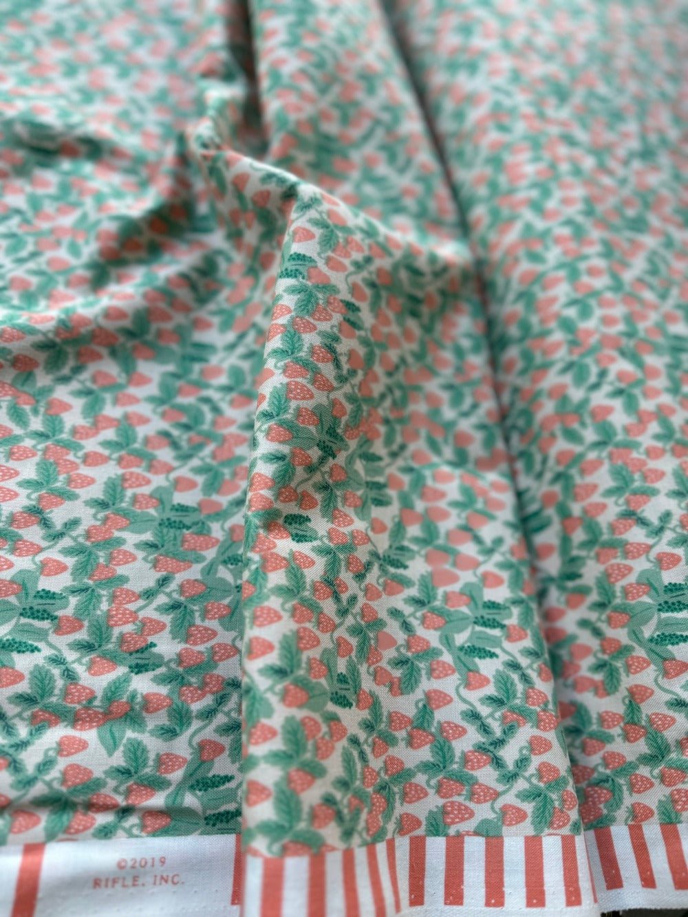 Strawberries Blush fabric – pink cotton with red strawberries by Rifle Paper Co. for Cotton + Steel.