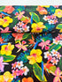 Island Sanctuary - Tropicals on Black Yardage