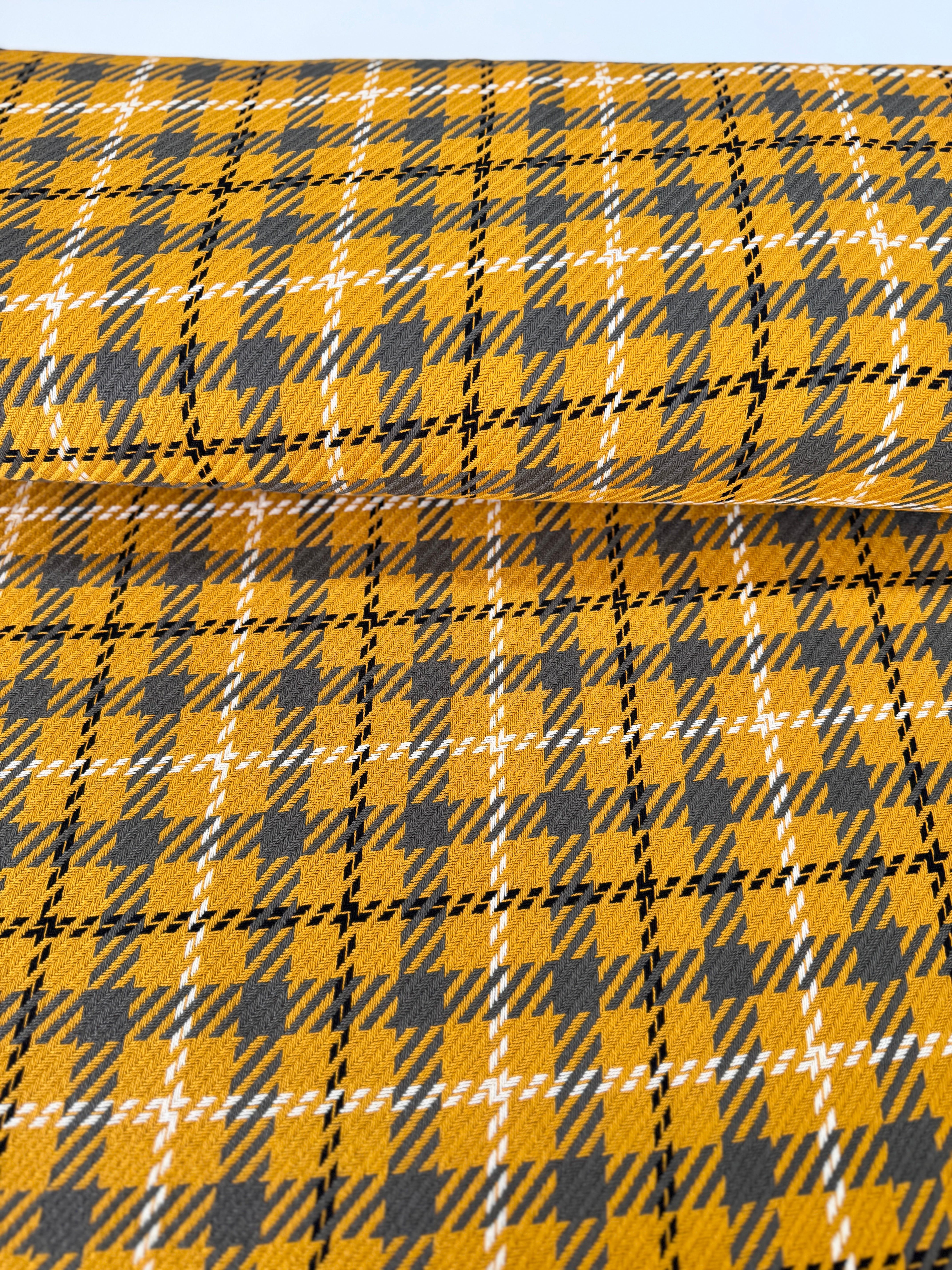 Close-up of Loomcraft Plaid Mustard fabric by Robert Kaufman – 100% cotton, heavyweight woven plaid in warm yellow tones, ideal for quilting or crafts.