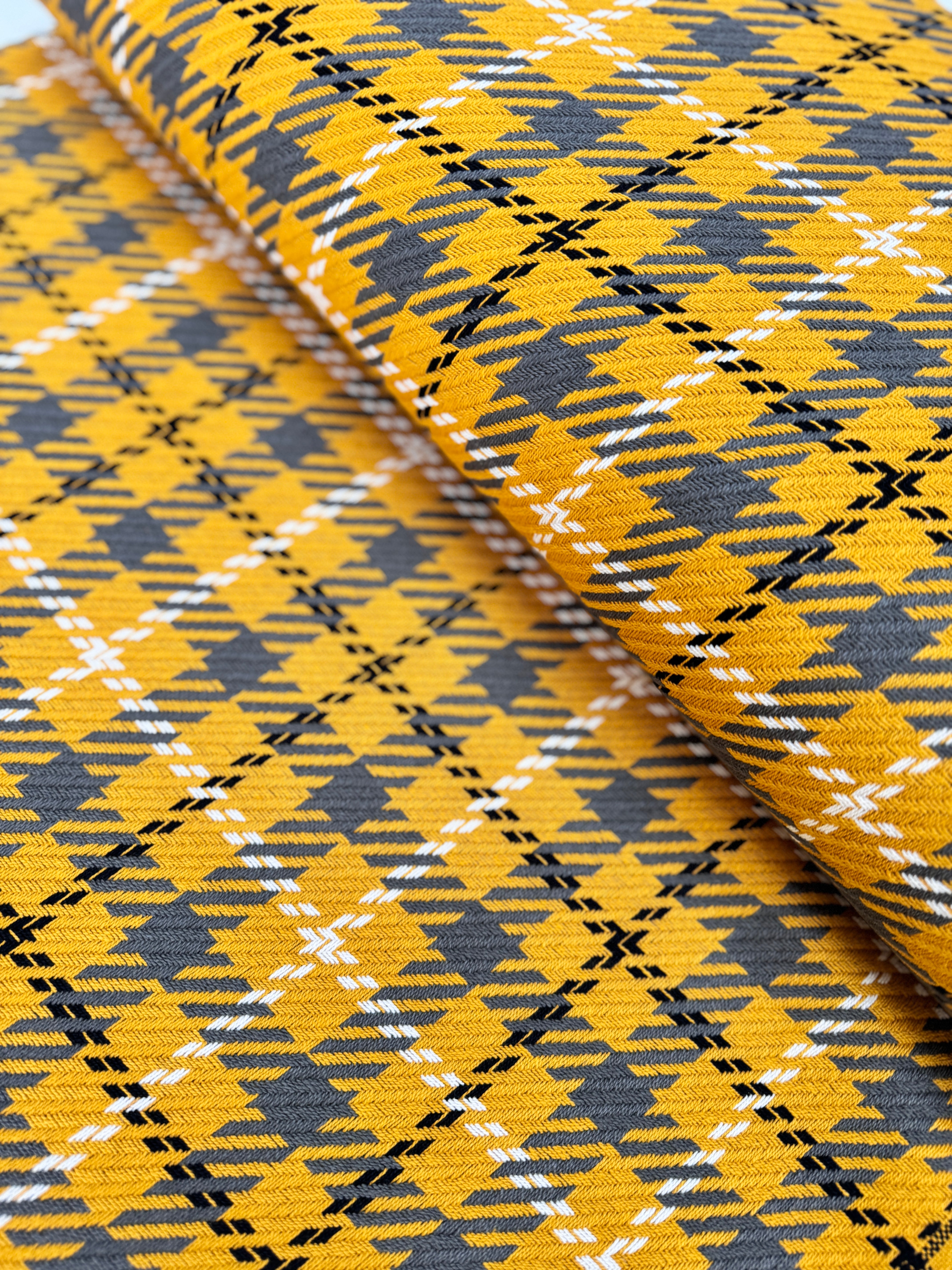 Close-up of Loomcraft Plaid Mustard fabric by Robert Kaufman – 100% cotton, heavyweight woven plaid in warm yellow tones, ideal for quilting or crafts.