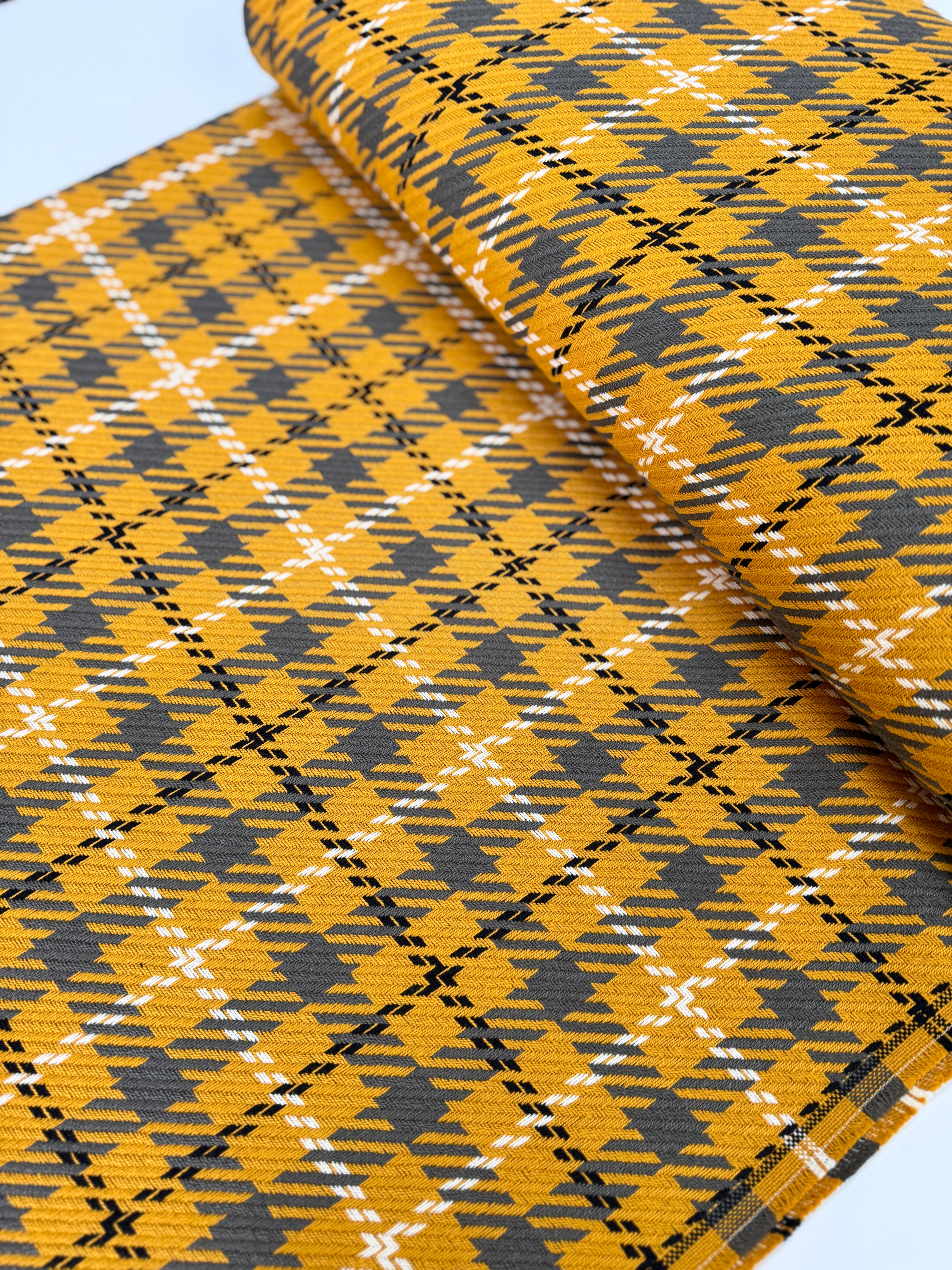 Close-up of Loomcraft Plaid Mustard fabric by Robert Kaufman – 100% cotton, heavyweight woven plaid in warm yellow tones, ideal for quilting or crafts.