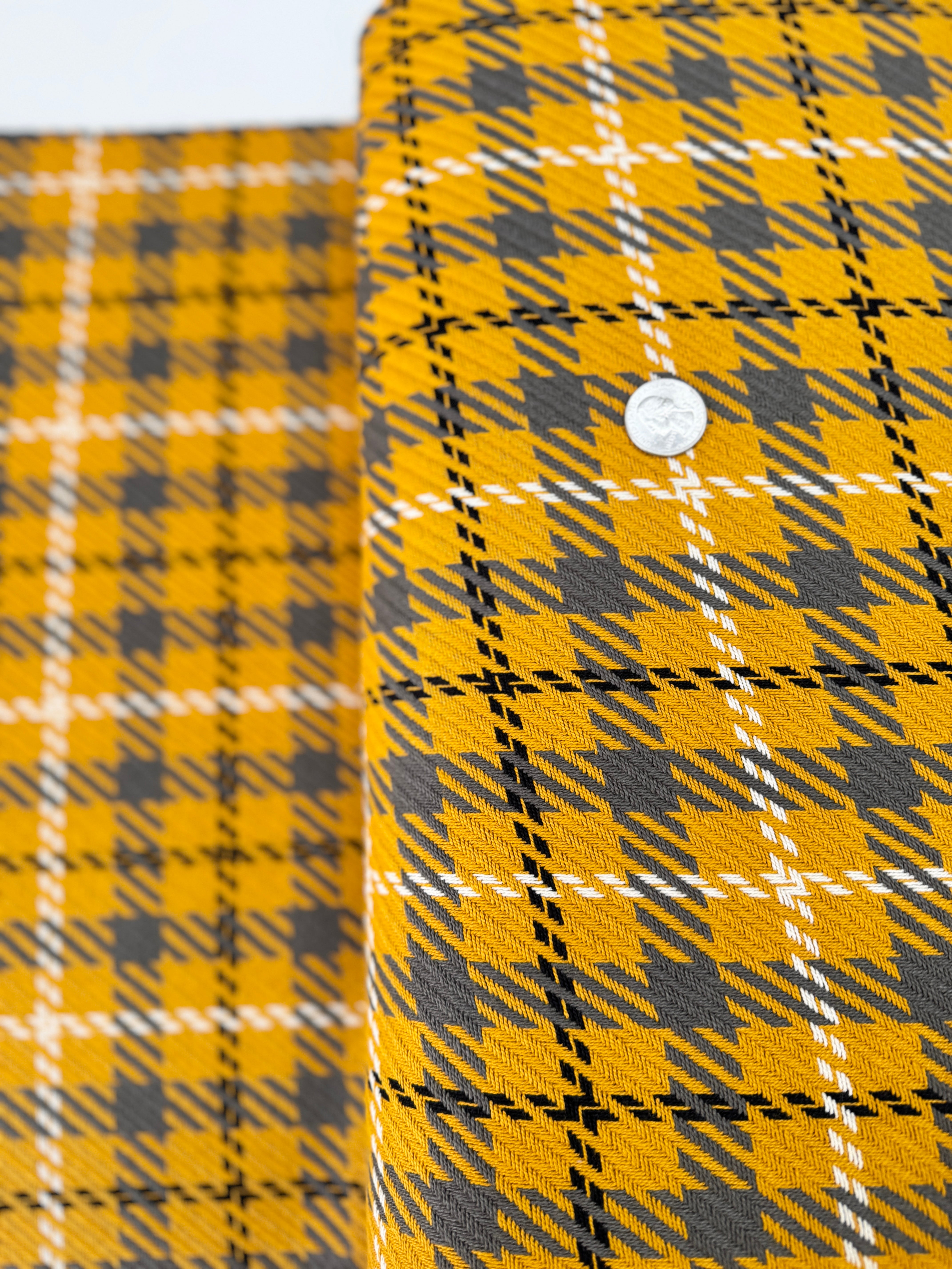 Close-up of Loomcraft Plaid Mustard fabric by Robert Kaufman – 100% cotton, heavyweight woven plaid in warm yellow tones, ideal for quilting or crafts.