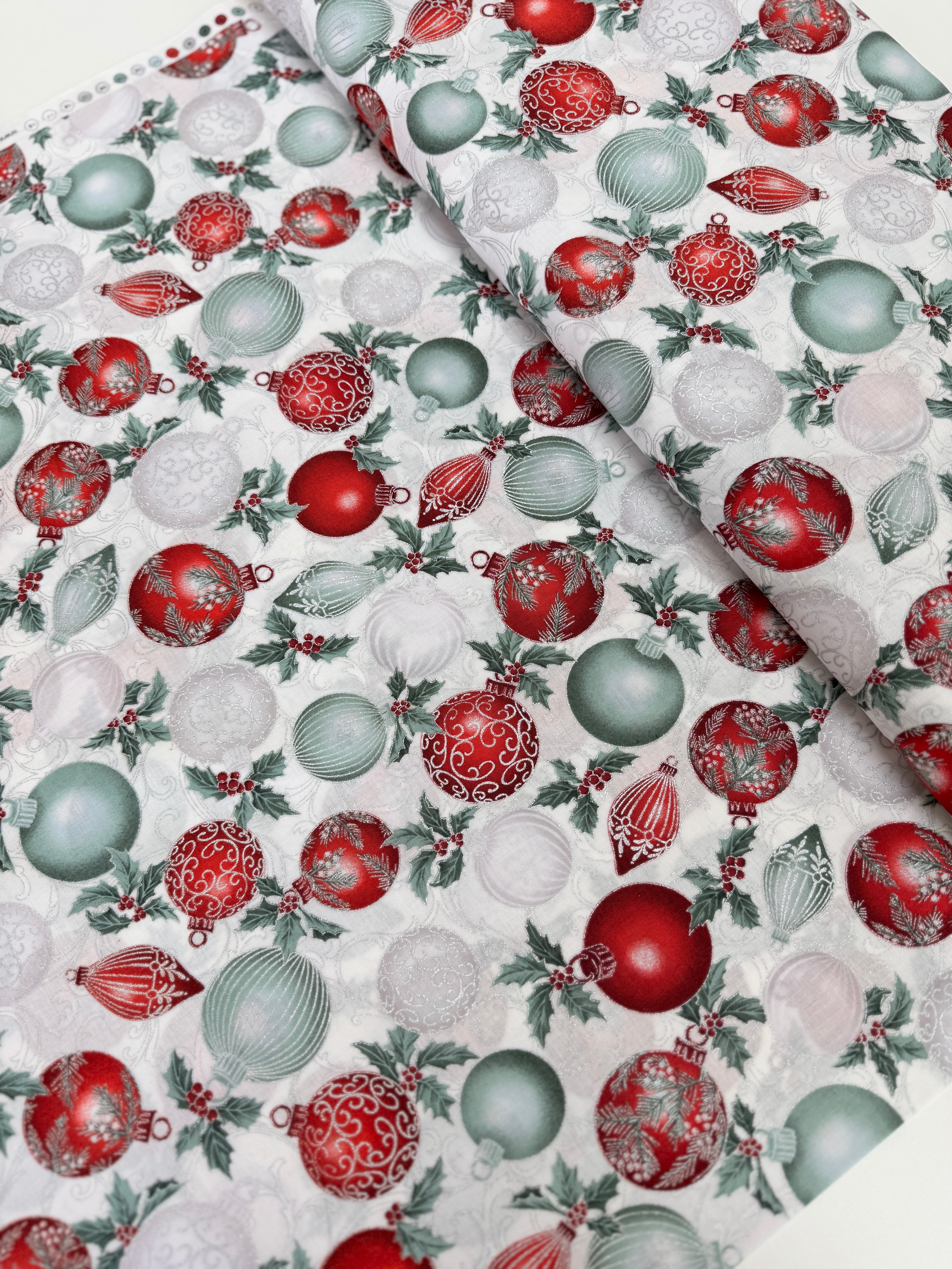Christmas Splendor - Ornaments Winter Cherry/Silver Metallic fabric by Hoffman Fabrics with festive red and silver metallic ornament print on 100% cotton.