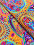 Kaffe Fassett Collective Paisley Jungle Tangerine Fabric GP60.TANG – vibrant multicolored paisley motifs on a rich tangerine background.