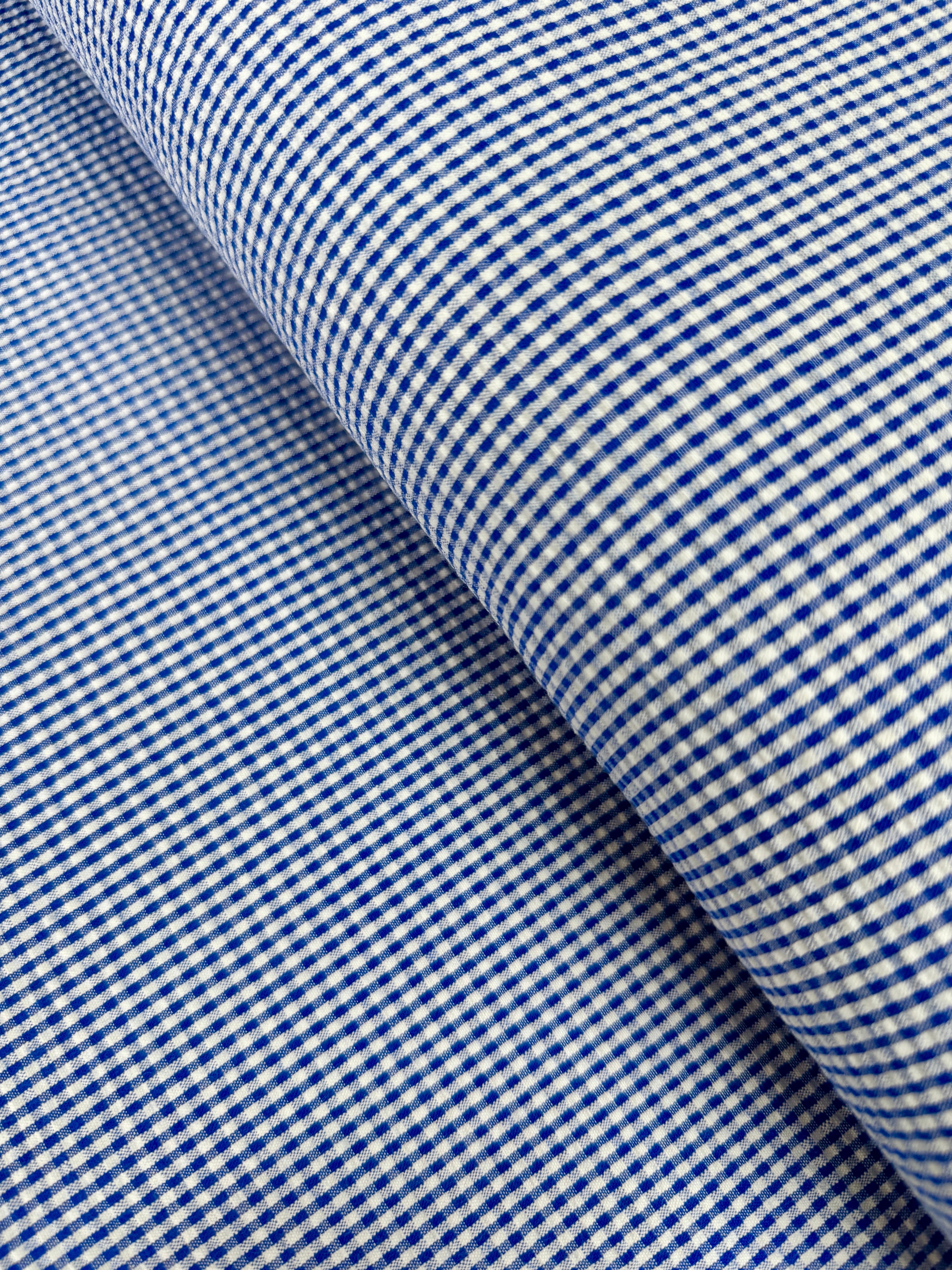 Seersucker Check Royal Fabric by Robert Kaufman – lightweight cotton/poly blend with royal blue checks and puckered texture.
