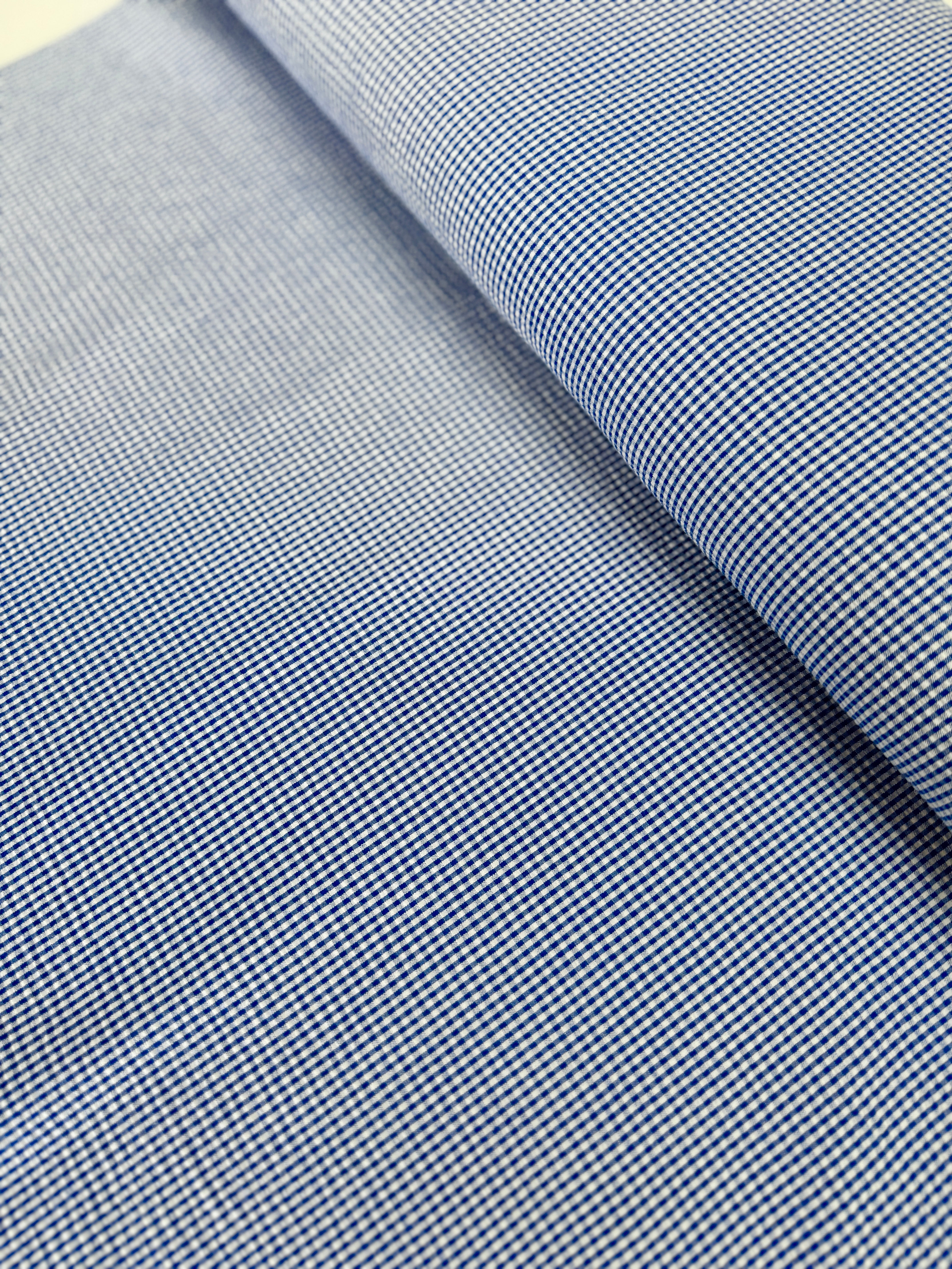 Seersucker Check Royal Fabric by Robert Kaufman – lightweight cotton/poly blend with royal blue checks and puckered texture.