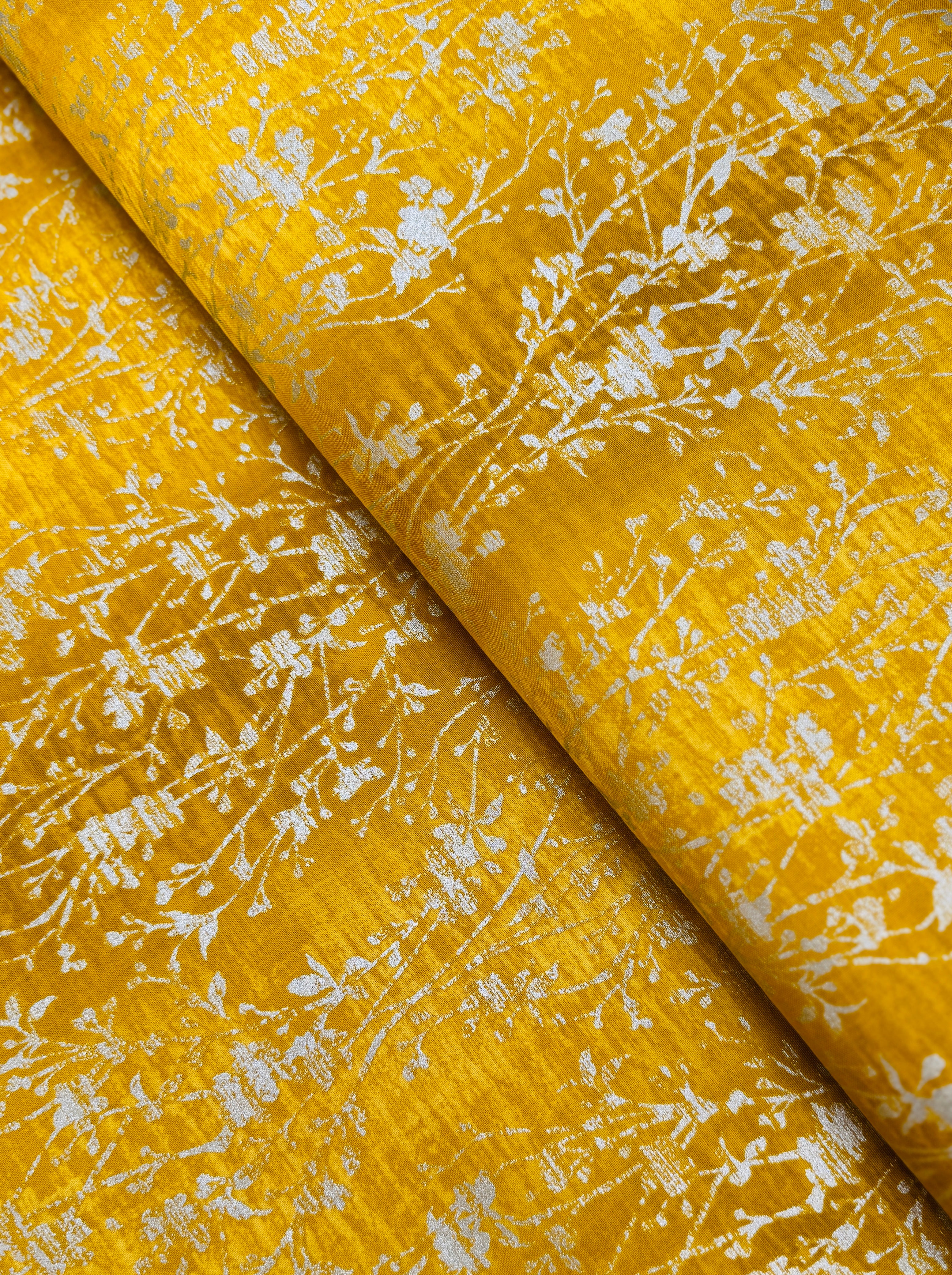 Shiny Objects – Velvety Vines Daffodil Metallic Fabric by Flaurie & Finch – Yellow cotton fabric with delicate gold metallic vine pattern.
