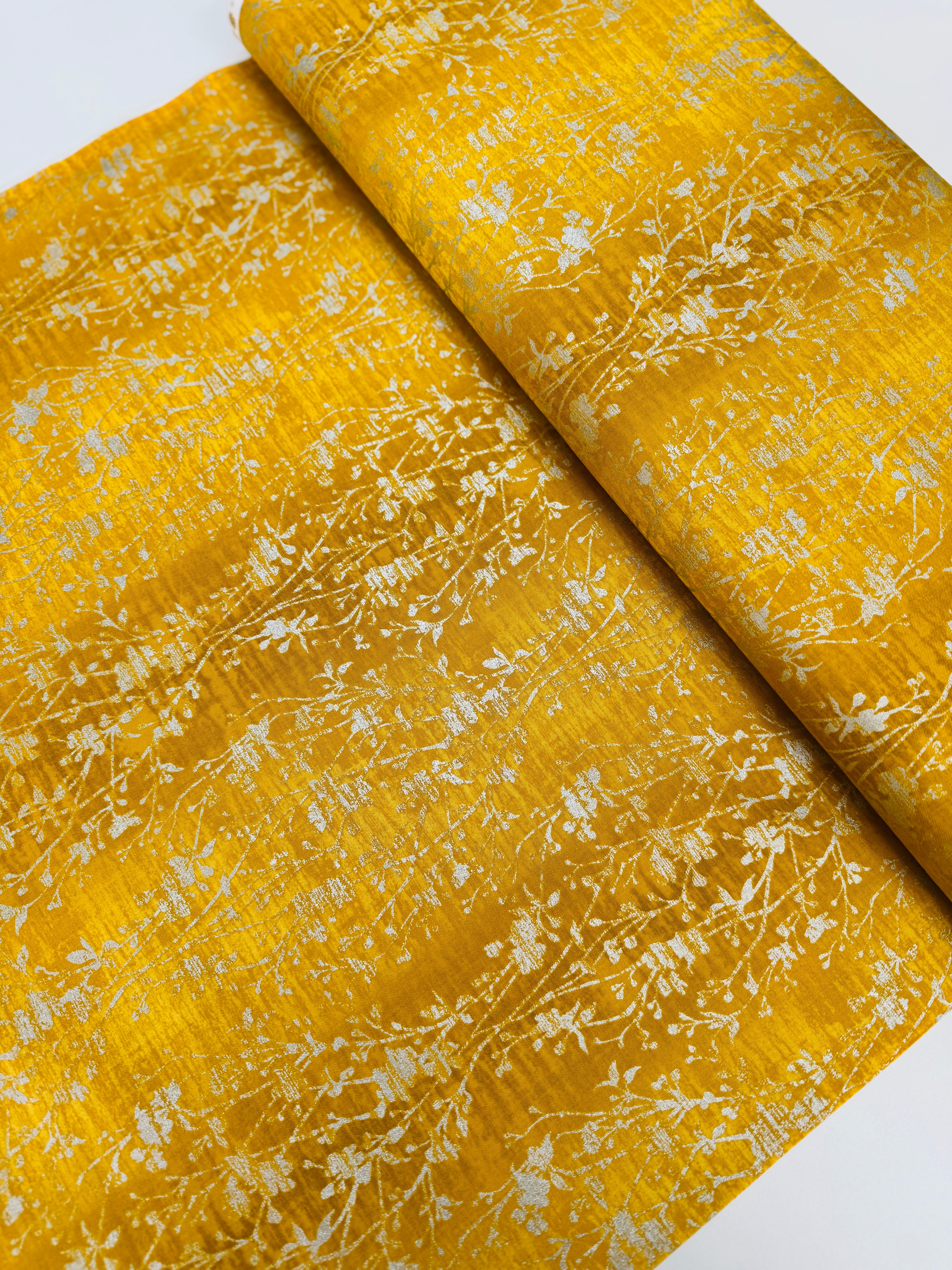 Shiny Objects – Velvety Vines Daffodil Metallic Fabric by Flaurie & Finch – Yellow cotton fabric with delicate gold metallic vine pattern.