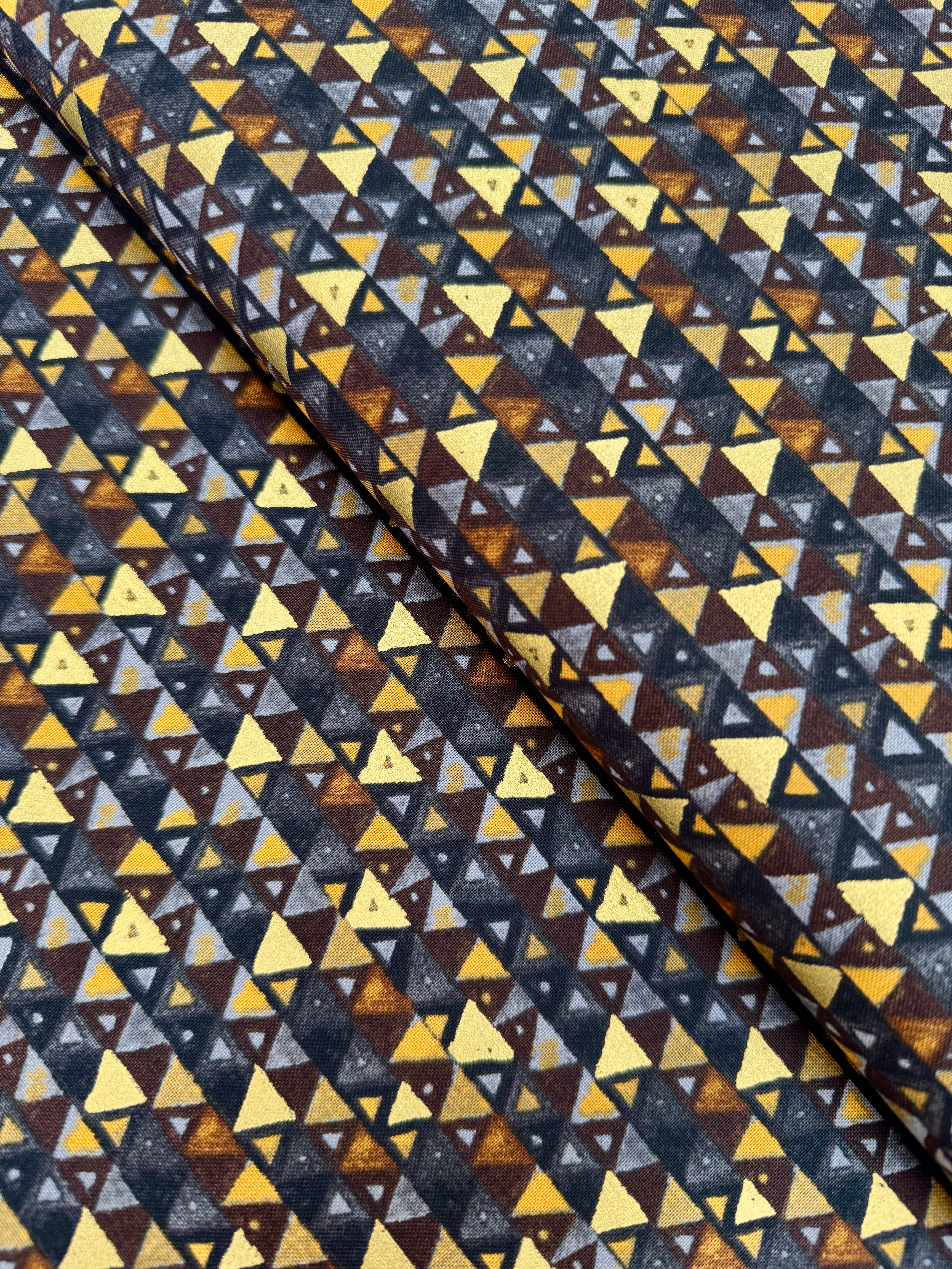 Gustav Klimt – Triangles Black Gold Metallic Fabric by Studio RK – Black cotton fabric with gold metallic triangle pattern.