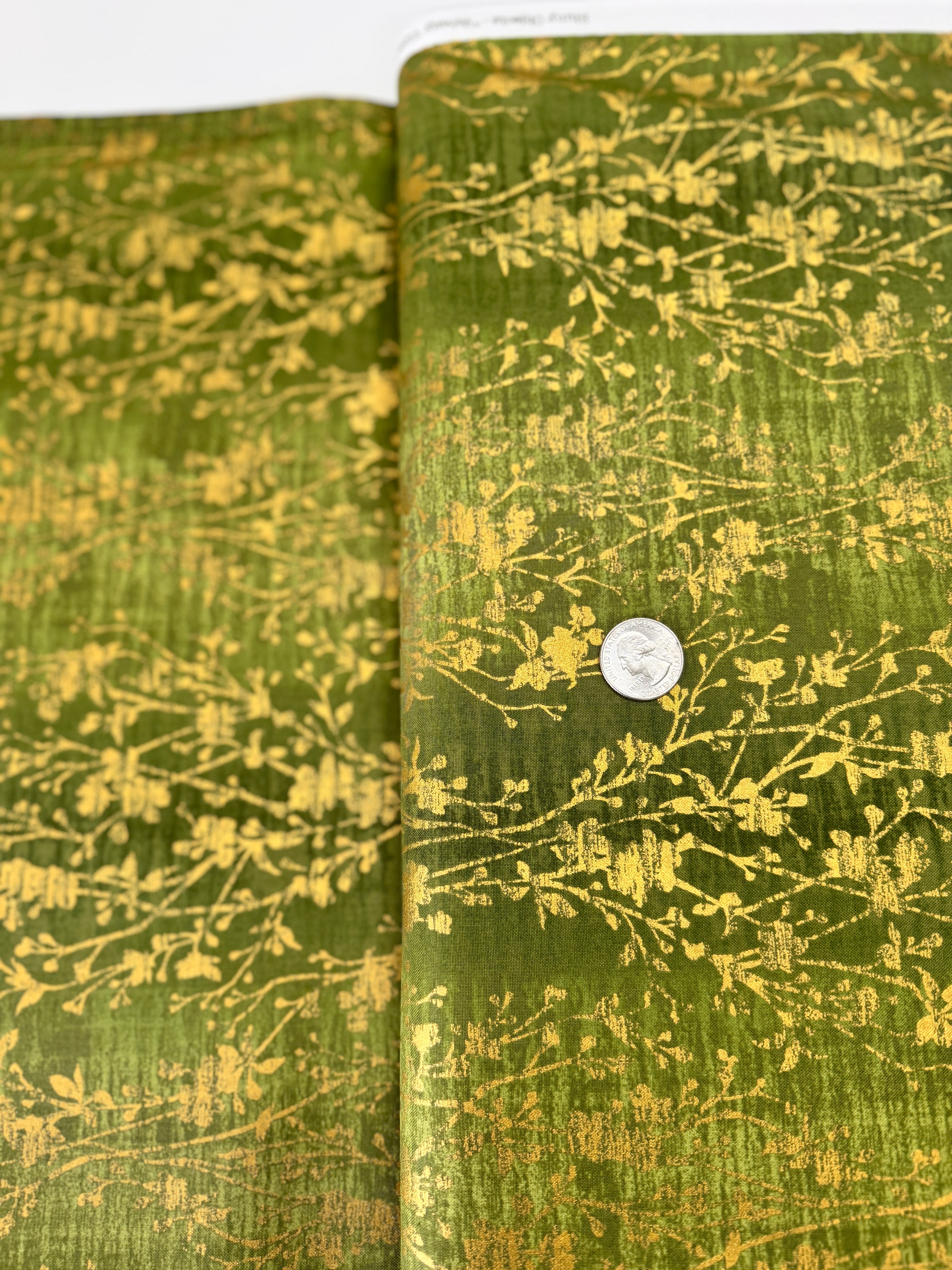Shiny Objects – Velvety Vines Pepper Grass Metallic Fabric by Flaurie & Finch – Green cotton fabric with subtle gold vine pattern.