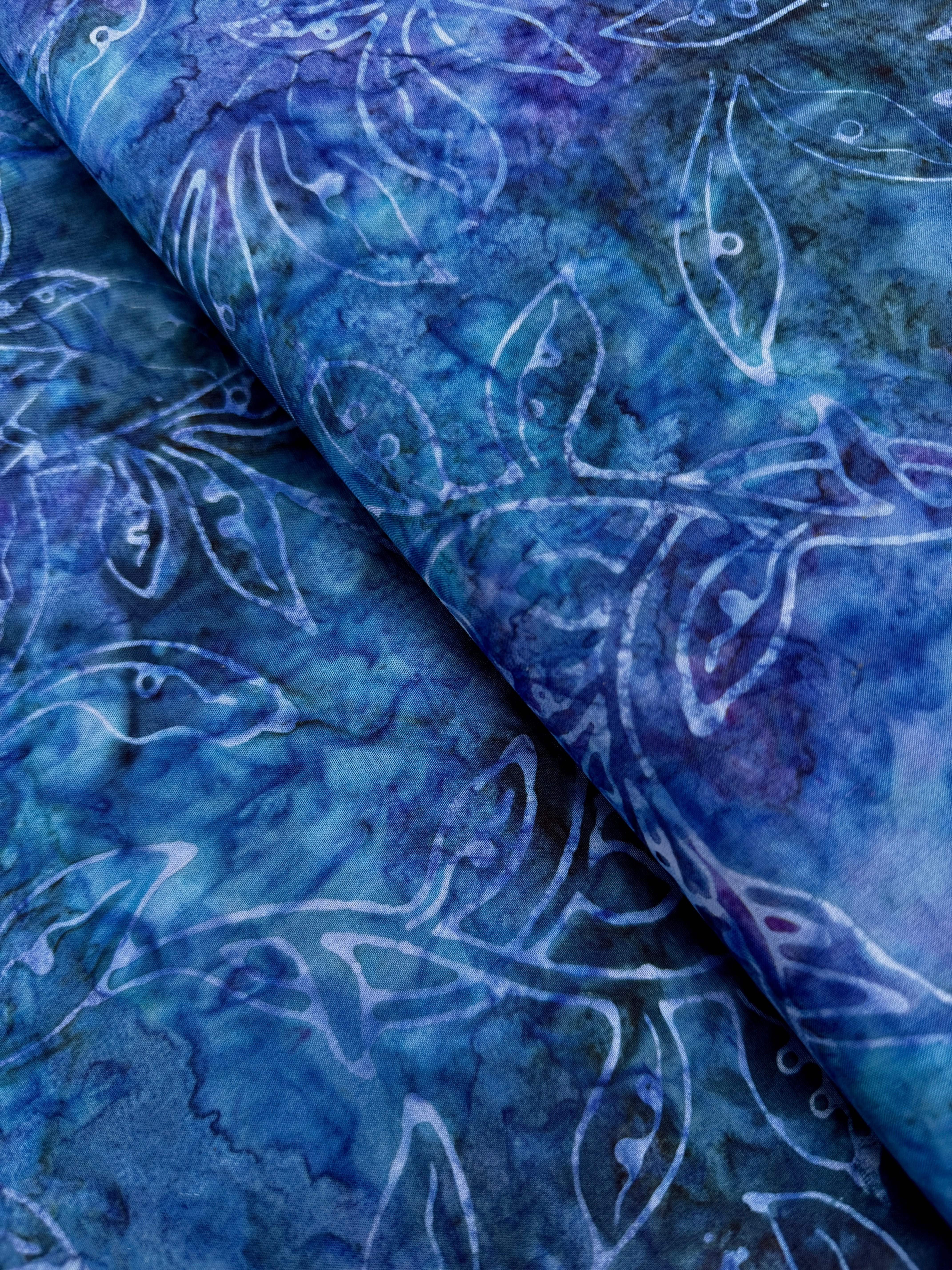 Best of Malam Batiks – Vine Leaf Sapphire Fabric by Jinny Beyer – deep blue hand-dyed batik cotton with leaf pattern.