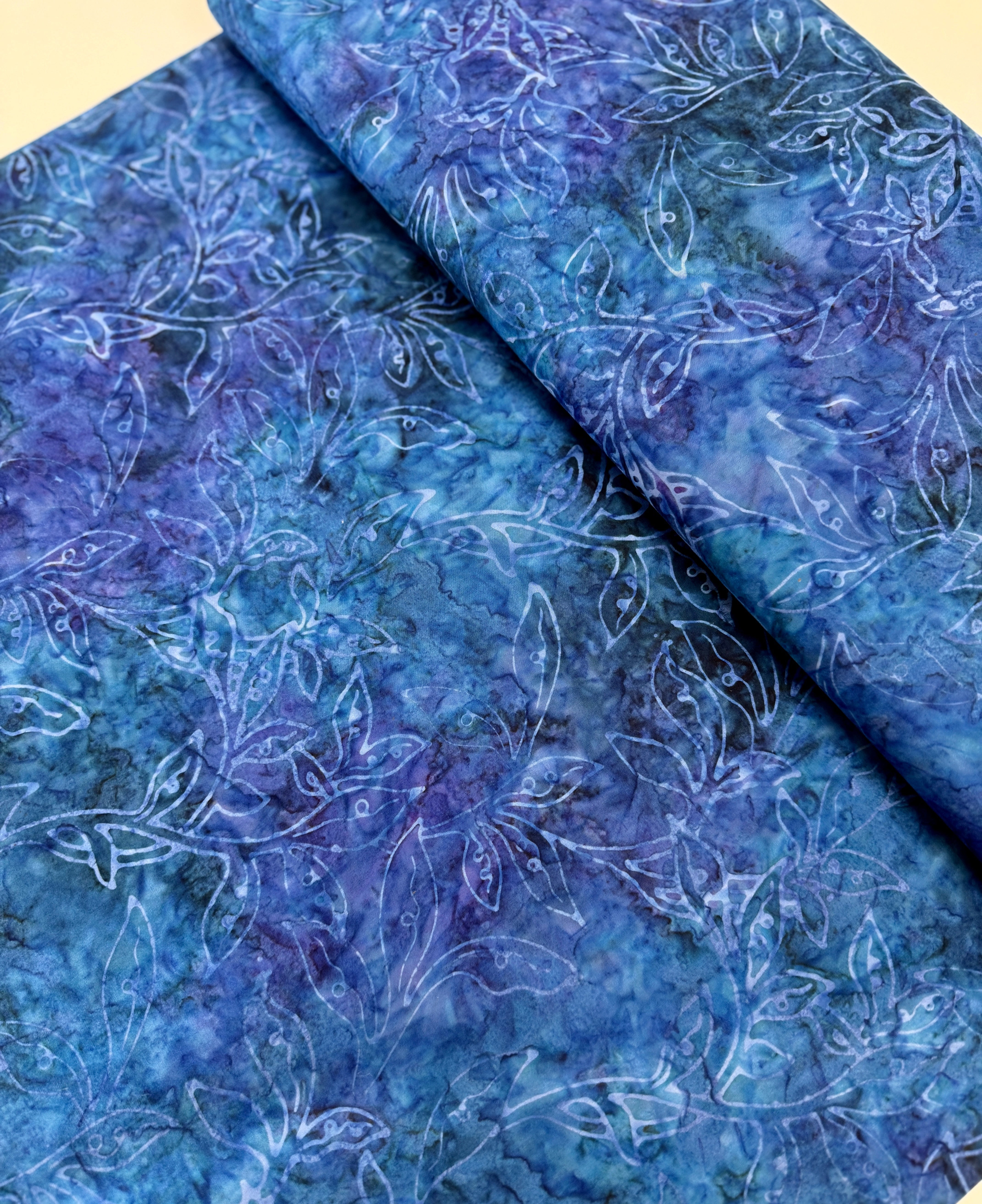Best of Malam Batiks – Vine Leaf Sapphire Fabric by Jinny Beyer – deep blue hand-dyed batik cotton with leaf pattern.