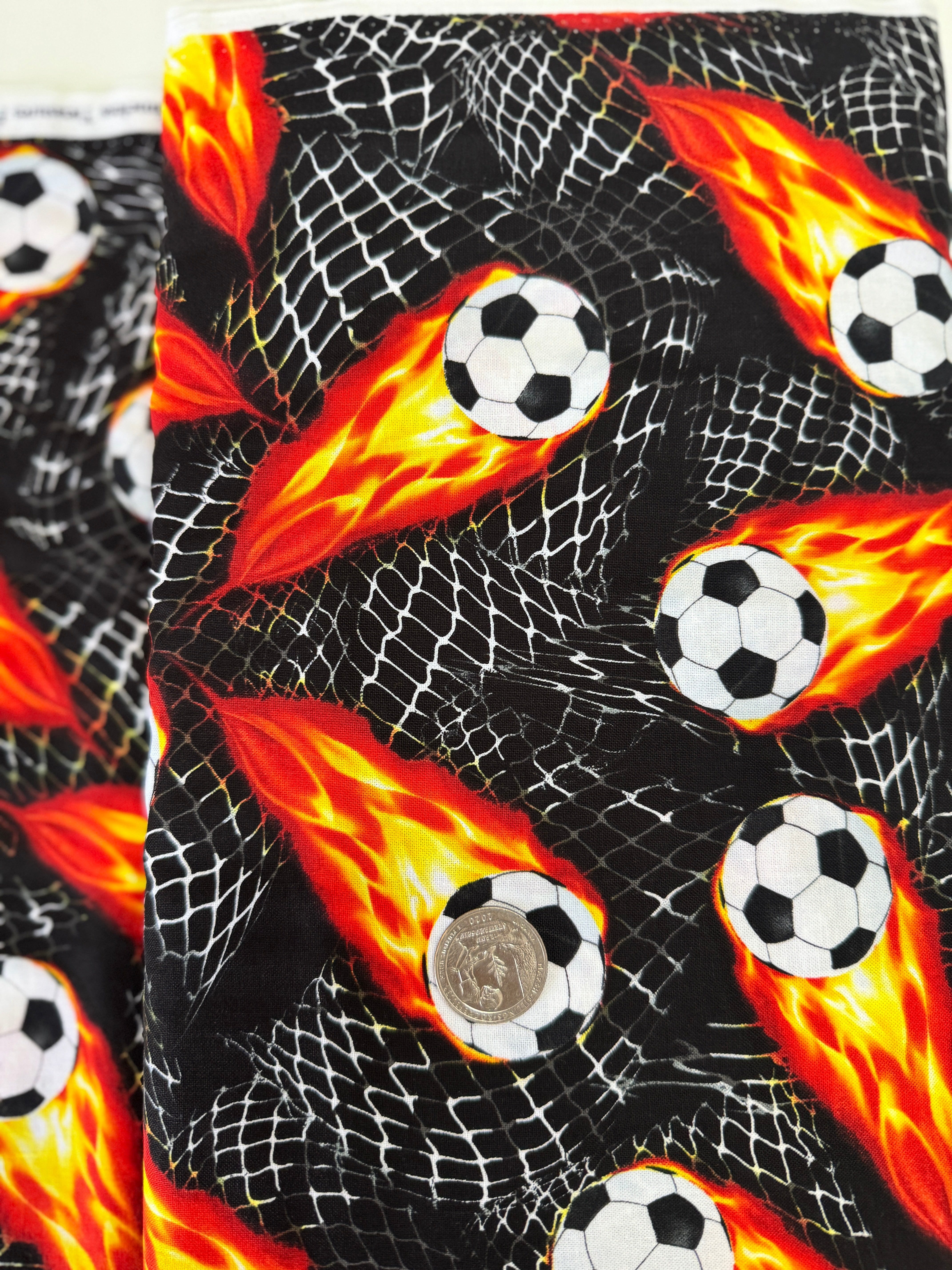 Flaming Soccer Balls Fabric – Goal! by Gail Cadden for Timeless Treasures, black cotton fabric with fiery soccer balls.