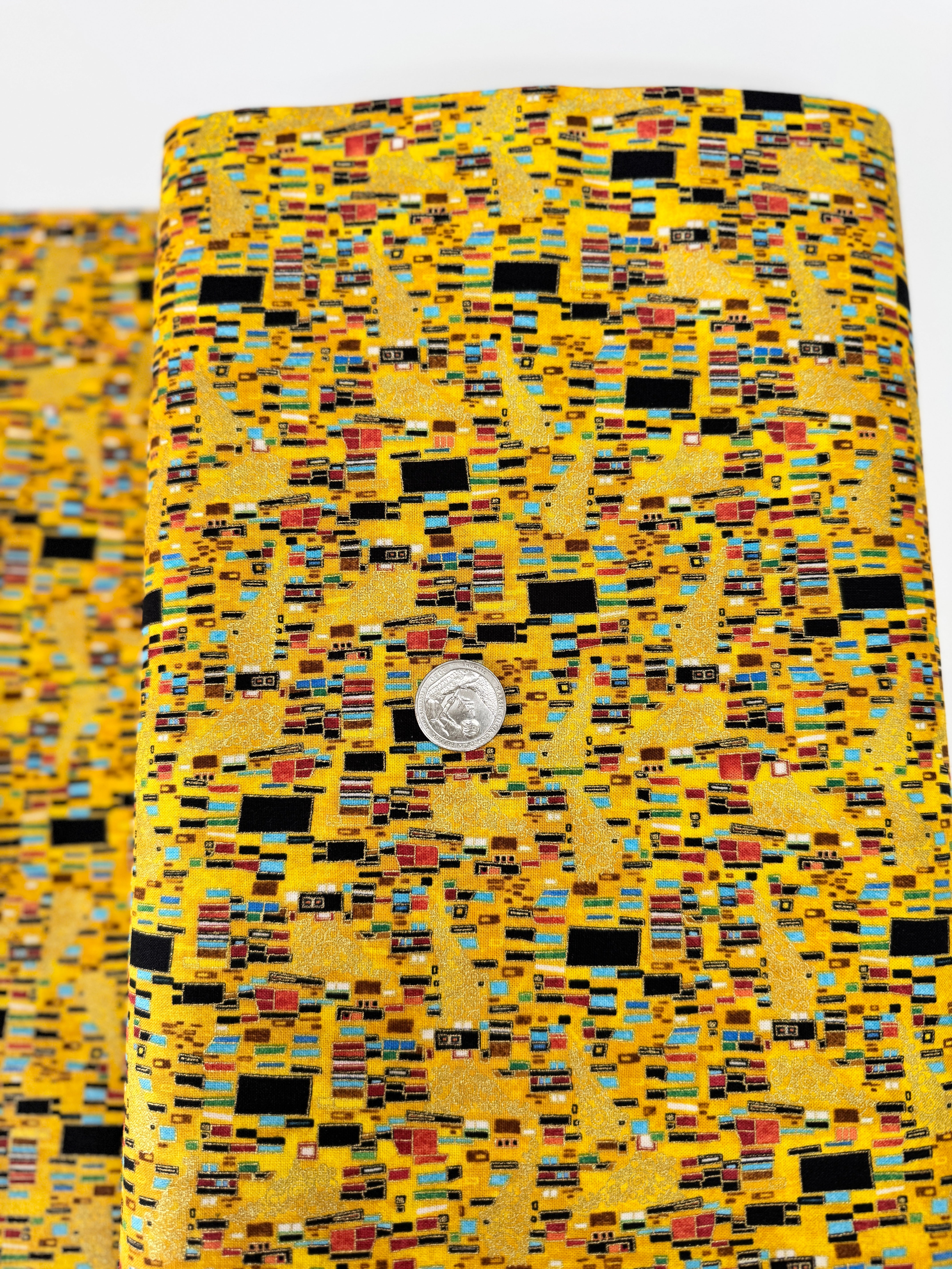 Cleo Bejeweled Golden Geo Abstract Square fabric – metallic cotton by Chong-a Hwang for Timeless Treasures with jewel tones and gold accents.