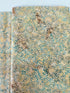 Sea Foam Leaf Vine Batik Fabric by Island Batik – tan and blue hand-dyed cotton with vine print for quilting and crafts.