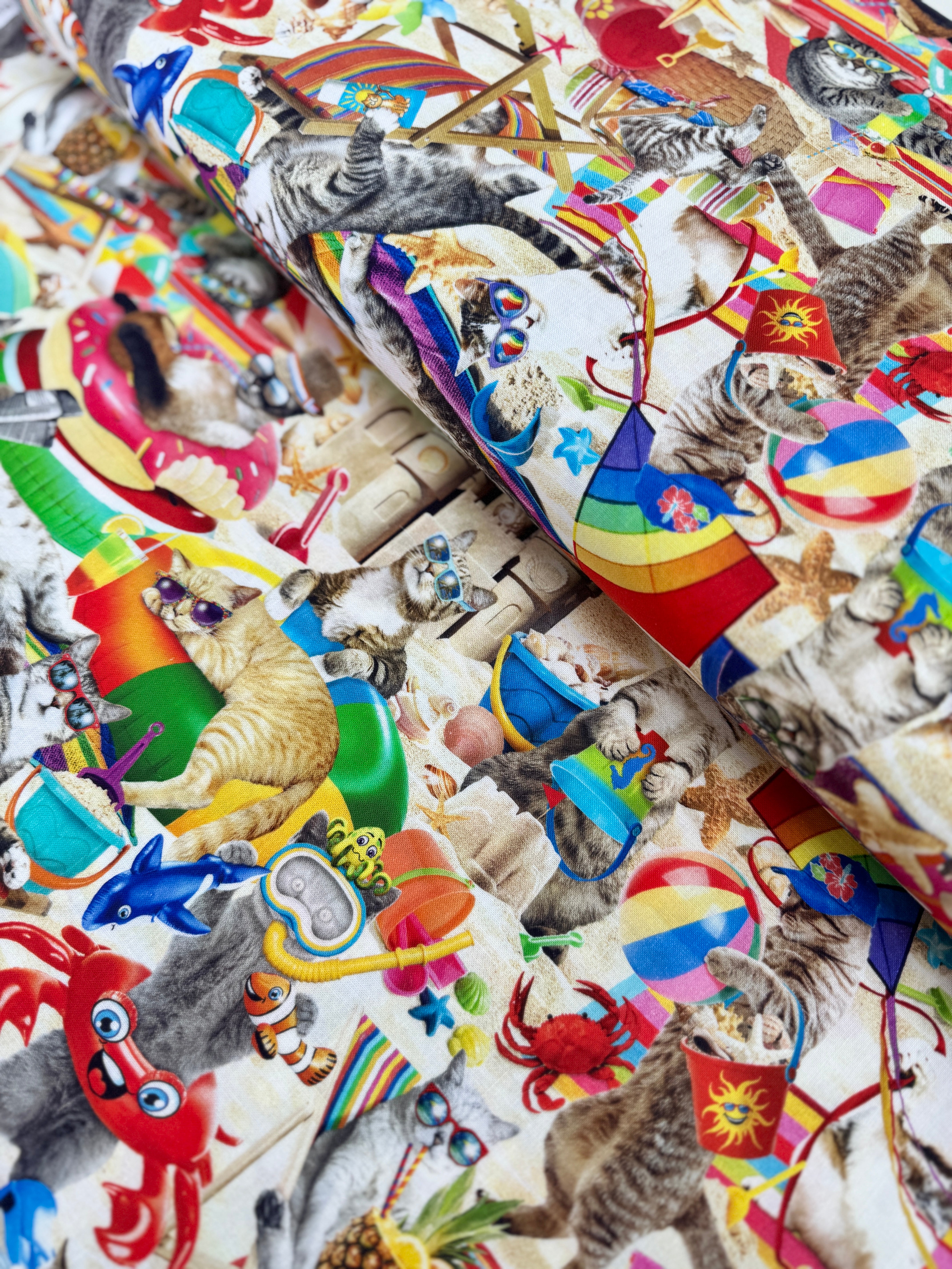 Cats Chilling on the Beach Fabric by Timeless Treasures – digital cotton print with cats relaxing at the beach in sunglasses.