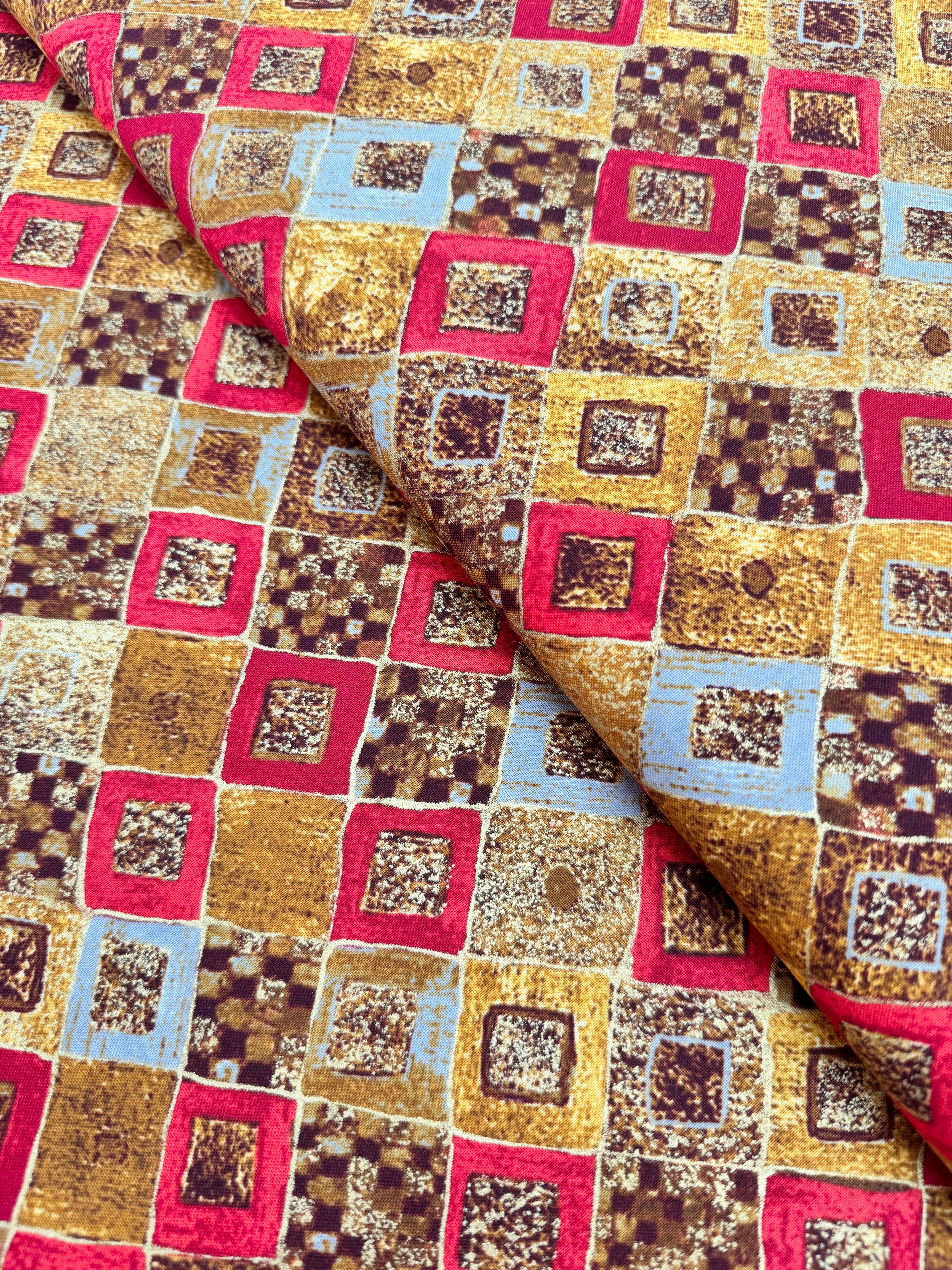 Gustav Klimt red fabric with gold metallic diamonds and squares – Studio RK for Robert Kaufman.
