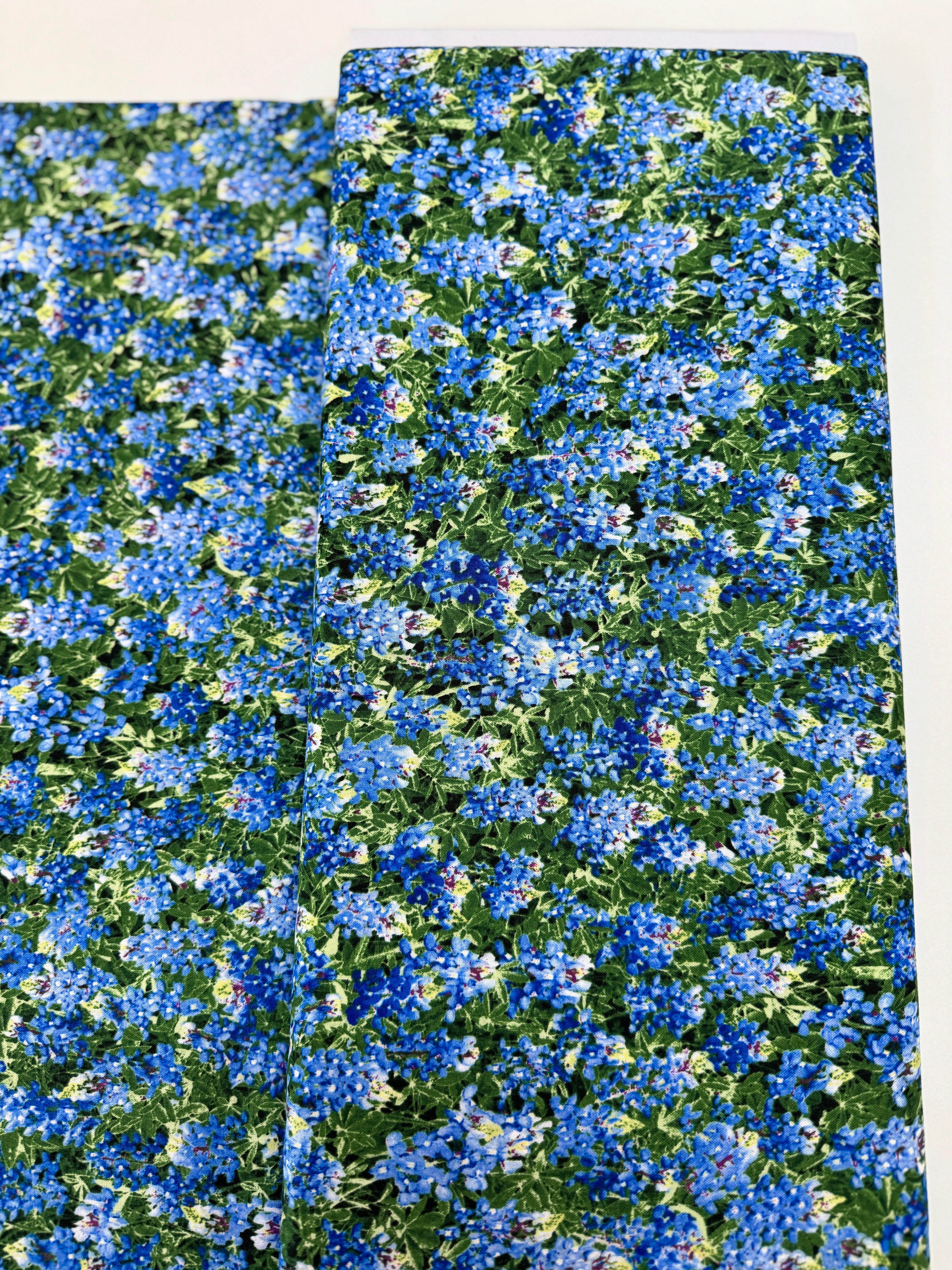Spring Beauty – Packed Blue Bonnets Fabric by Timeless Treasures – 100% cotton wildflower print in blue and green.