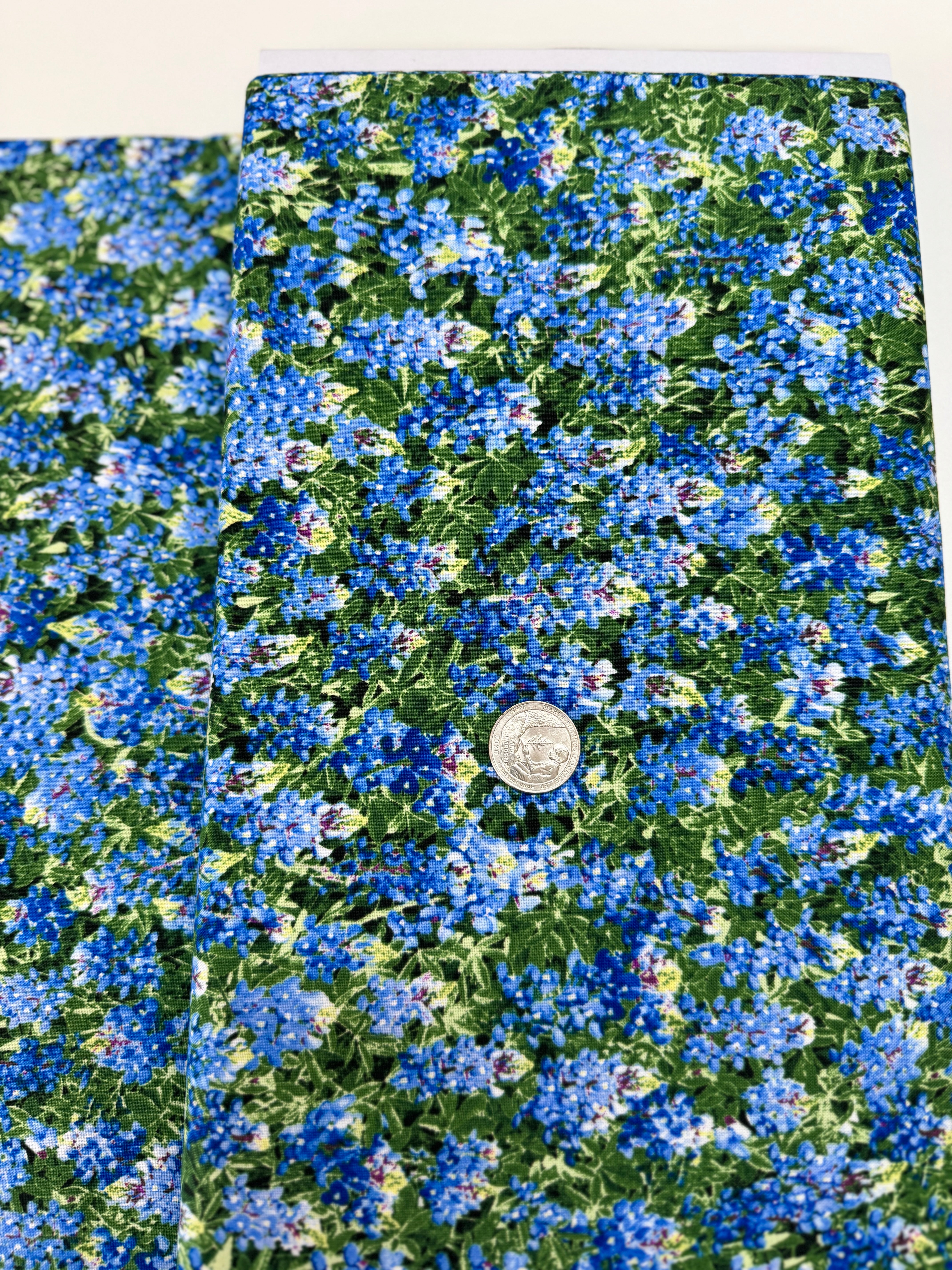 Spring Beauty – Packed Blue Bonnets Fabric by Timeless Treasures – 100% cotton wildflower print in blue and green.