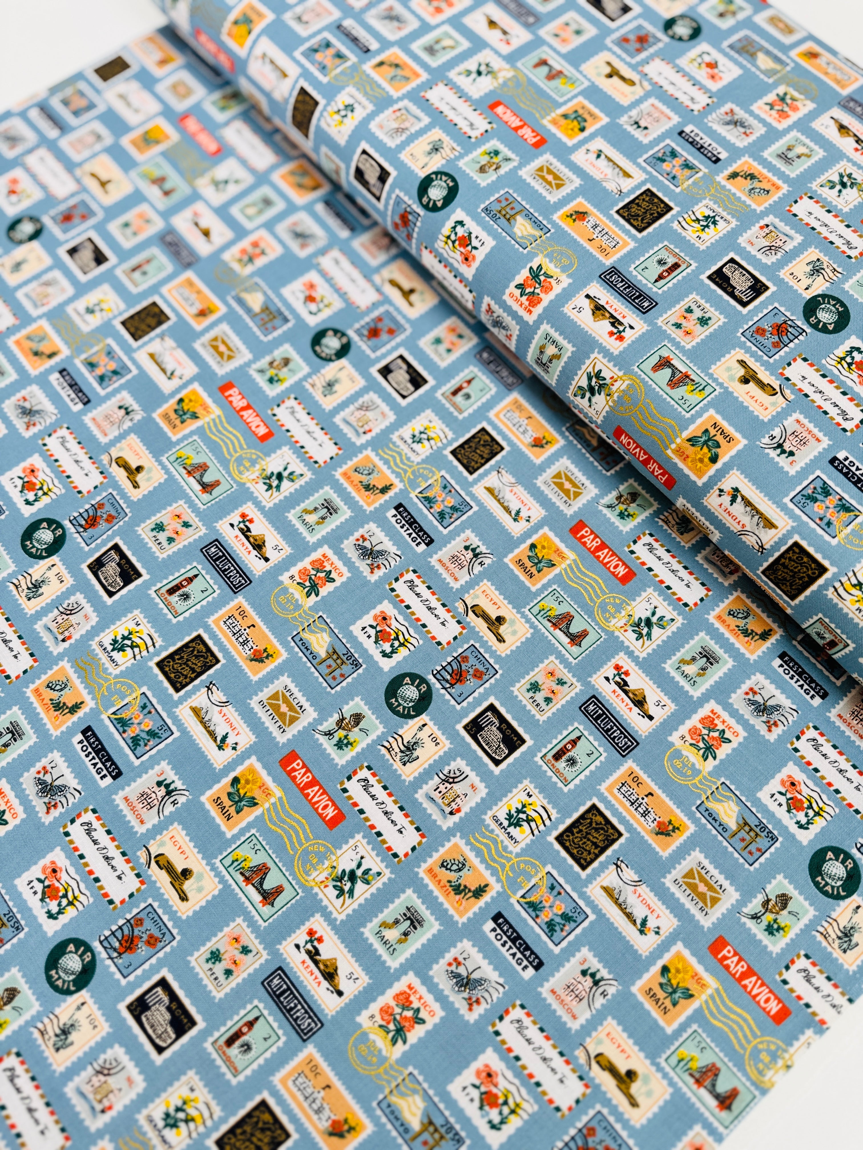 Bon Voyage Postage Stamps Blue Metallic Fabric by Rifle Paper Co.