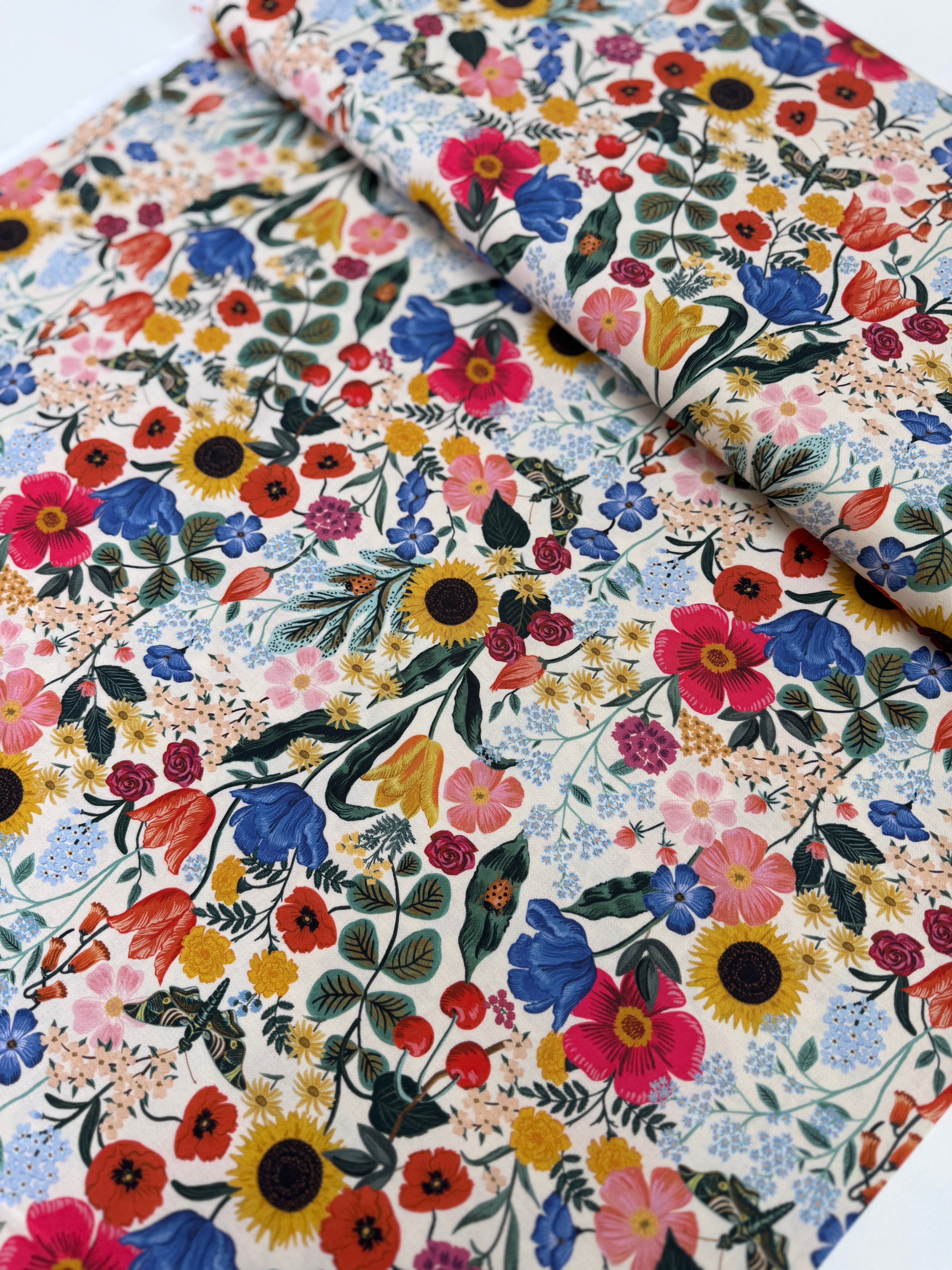 Curio Blossom Blush digiprint cotton fabric by Rifle Paper Co. for Cotton + Steel featuring soft pink floral blossoms.