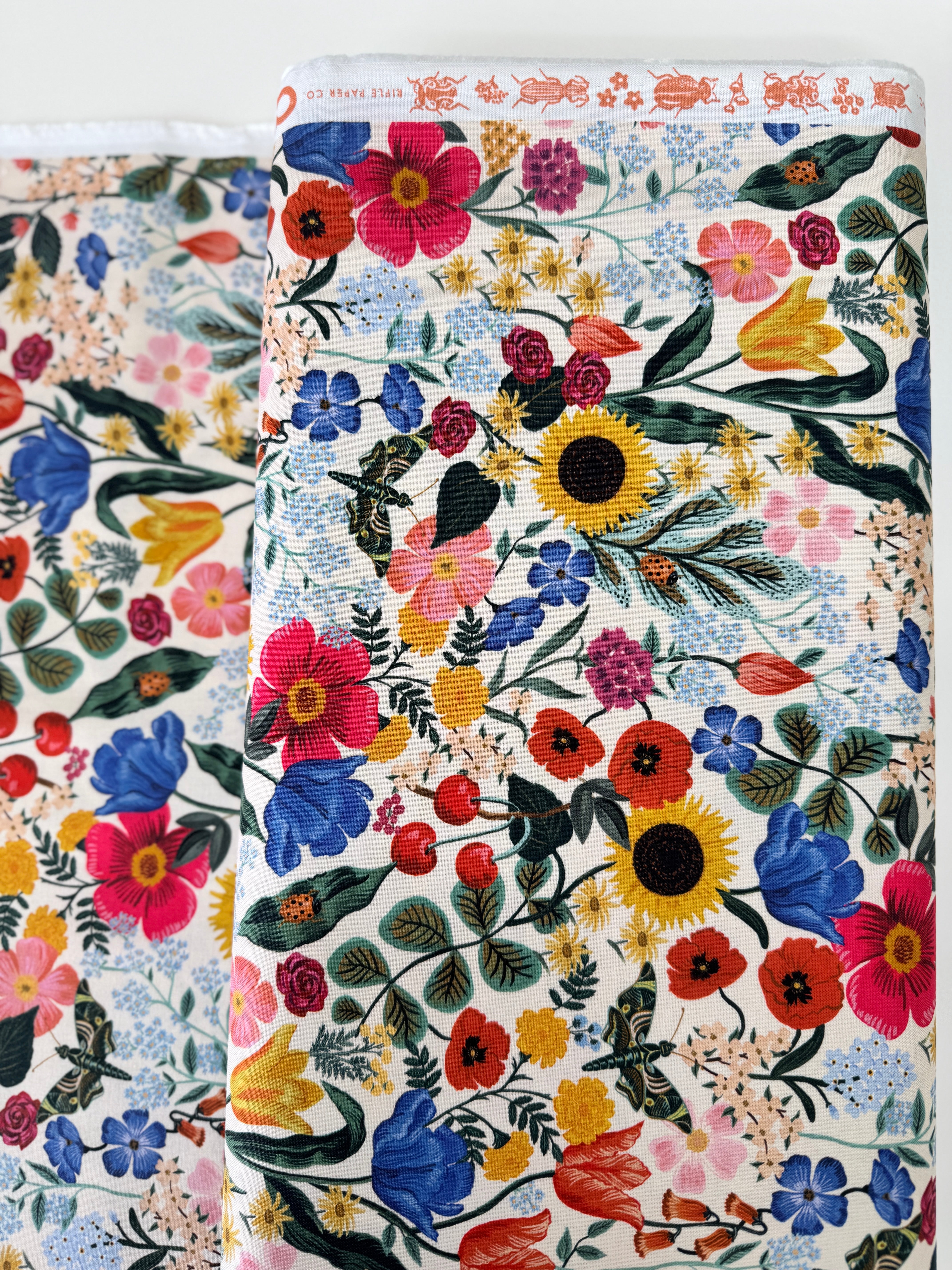 Curio Blossom Blush digiprint cotton fabric by Rifle Paper Co. for Cotton + Steel featuring soft pink floral blossoms.